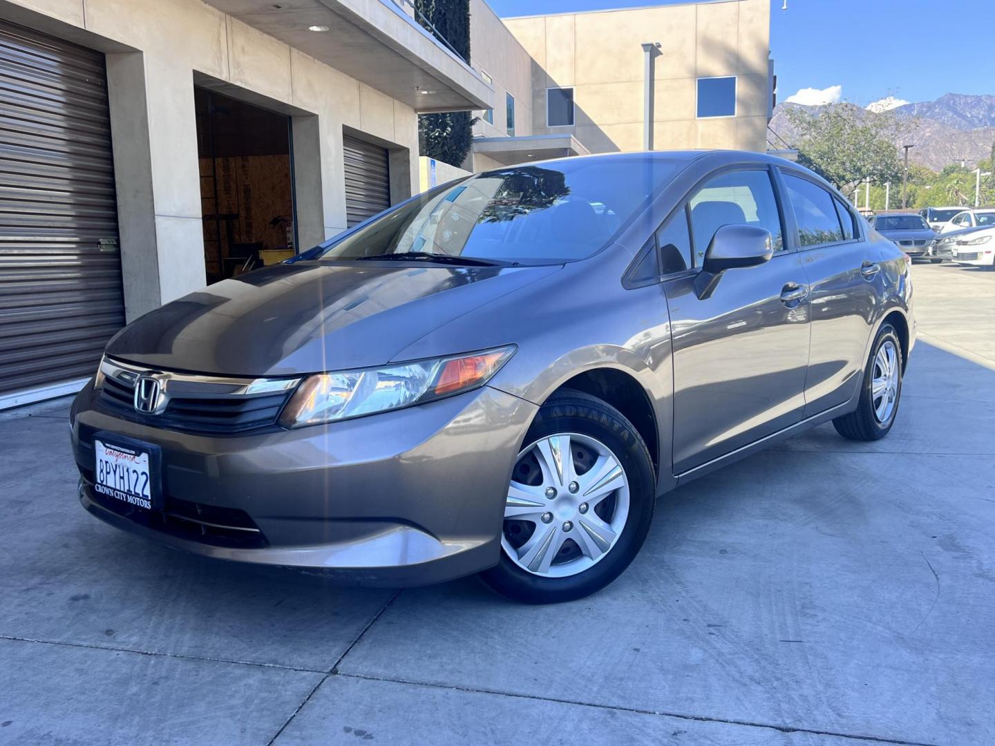 2012 Urban Titanium Metallic /Tan Honda Civic LX Sedan 5-Speed AT (19XFB2F59CE) with an 1.8L L4 SOHC 16V engine, 5-Speed Automatic transmission, located at 30 S. Berkeley Avenue, Pasadena, CA, 91107, (626) 248-7567, 34.145447, -118.109398 - 2012 Honda Civic – Reliable Sedan with Buy Here Pay Here Financing in Pasadena, CA If you’re searching for a dependable, fuel-efficient, and affordable car that also qualifies for Buy Here Pay Here financing in Pasadena, this 2012 Honda Civic is an excellent choice. Known for its long-lasting - Photo#1
