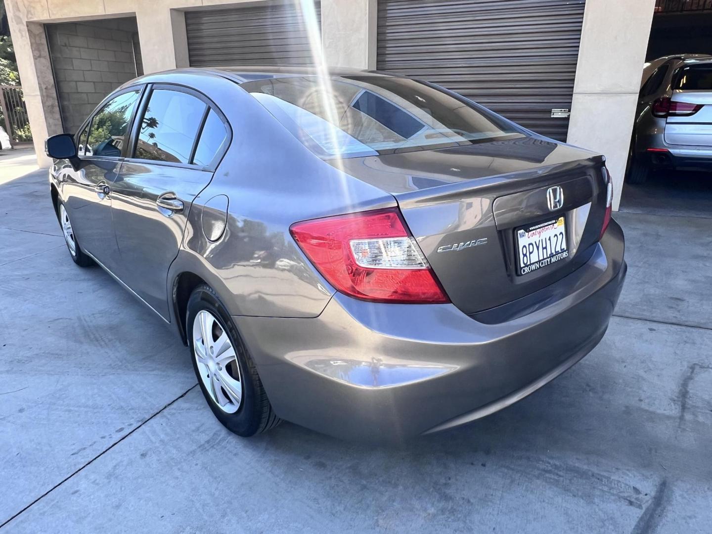 2012 Urban Titanium Metallic /Tan Honda Civic LX Sedan 5-Speed AT (19XFB2F59CE) with an 1.8L L4 SOHC 16V engine, 5-Speed Automatic transmission, located at 30 S. Berkeley Avenue, Pasadena, CA, 91107, (626) 248-7567, 34.145447, -118.109398 - 2012 Honda Civic – Reliable Sedan with Buy Here Pay Here Financing in Pasadena, CA If you’re searching for a dependable, fuel-efficient, and affordable car that also qualifies for Buy Here Pay Here financing in Pasadena, this 2012 Honda Civic is an excellent choice. Known for its long-lasting - Photo#3
