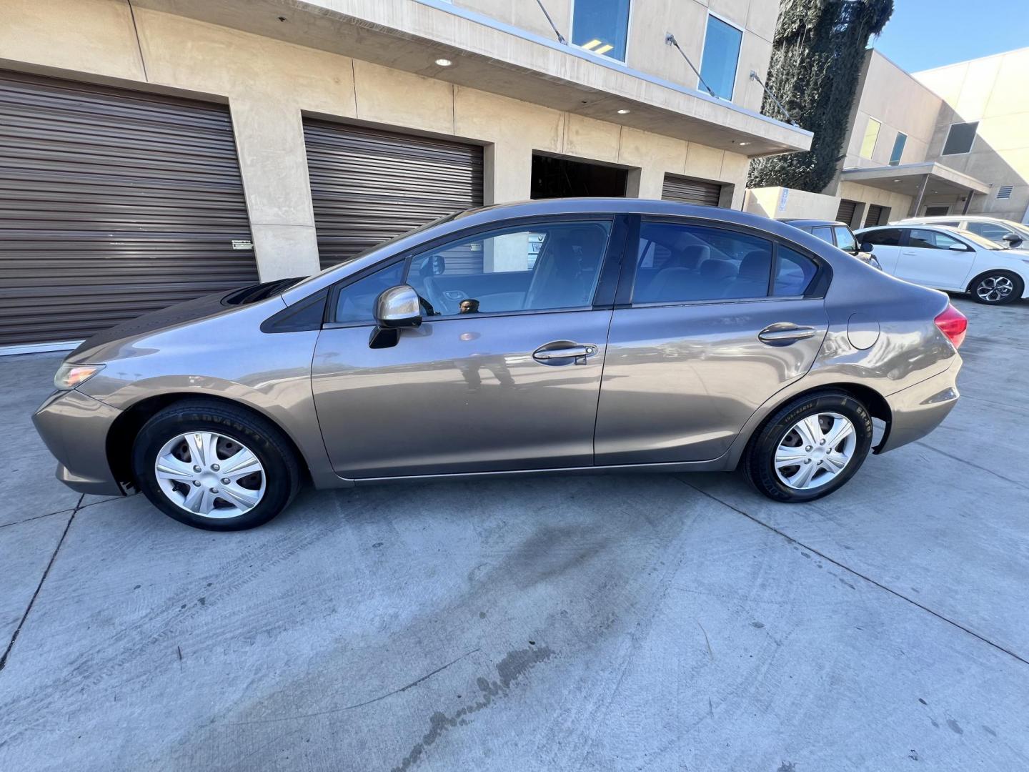 2012 Urban Titanium Metallic /Tan Honda Civic LX Sedan 5-Speed AT (19XFB2F59CE) with an 1.8L L4 SOHC 16V engine, 5-Speed Automatic transmission, located at 30 S. Berkeley Avenue, Pasadena, CA, 91107, (626) 248-7567, 34.145447, -118.109398 - 2012 Honda Civic – Reliable Sedan with Buy Here Pay Here Financing in Pasadena, CA If you’re searching for a dependable, fuel-efficient, and affordable car that also qualifies for Buy Here Pay Here financing in Pasadena, this 2012 Honda Civic is an excellent choice. Known for its long-lasting - Photo#2