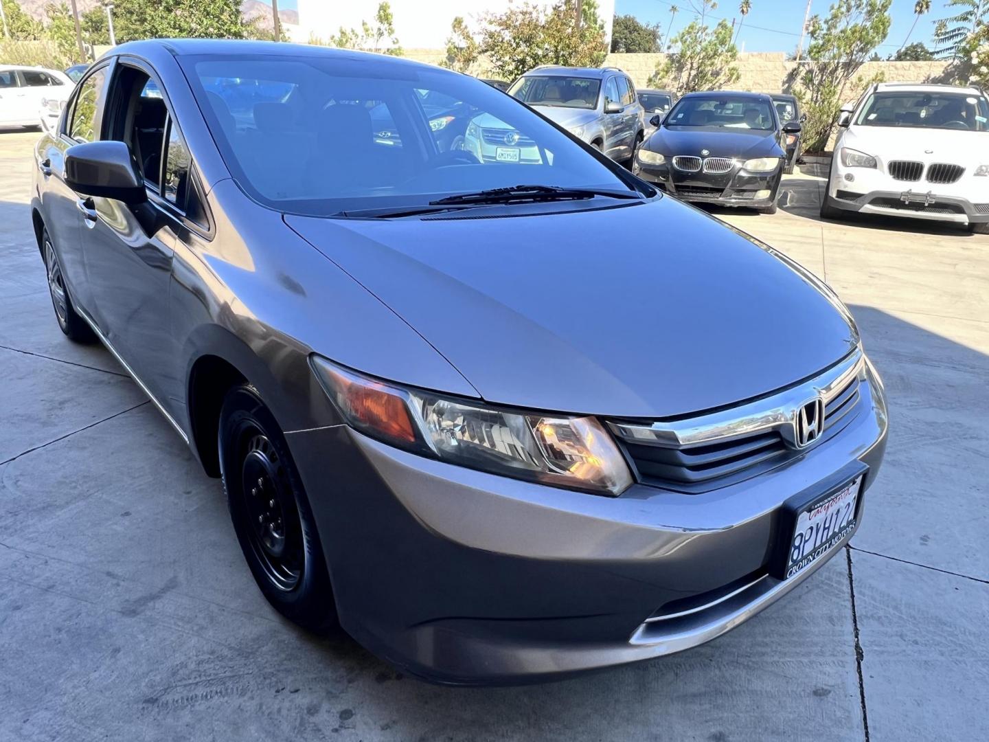 2012 Urban Titanium Metallic /Tan Honda Civic LX Sedan 5-Speed AT (19XFB2F59CE) with an 1.8L L4 SOHC 16V engine, 5-Speed Automatic transmission, located at 30 S. Berkeley Avenue, Pasadena, CA, 91107, (626) 248-7567, 34.145447, -118.109398 - 2012 Honda Civic – Reliable Sedan with Buy Here Pay Here Financing in Pasadena, CA If you’re searching for a dependable, fuel-efficient, and affordable car that also qualifies for Buy Here Pay Here financing in Pasadena, this 2012 Honda Civic is an excellent choice. Known for its long-lasting - Photo#5