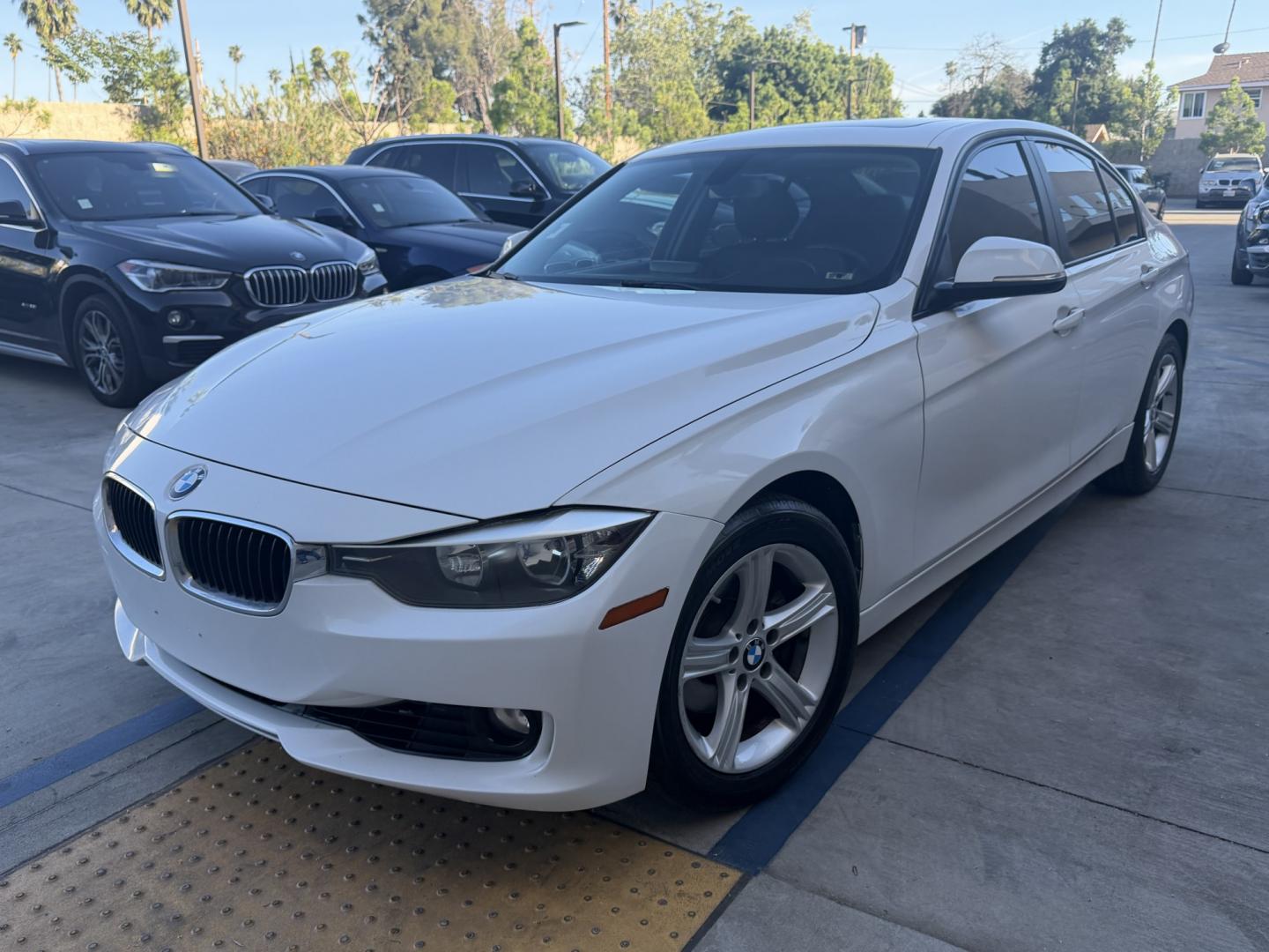 2013 White /Black BMW 3-Series 328i Sedan (WBA3C1C56DK) with an 2.0L L4 DOHC 16V engine, Automatic transmission, located at 30 S. Berkeley Avenue, Pasadena, CA, 91107, (626) 248-7567, 34.145447, -118.109398 - Looking for a sleek and stylish sedan that won't break the bank? Look no further than this 2013 BMW 3-Series 328i Sedan. With its classic design and top-of-the-line features, this car is sure to turn heads on the road. And with our buy here pay here financing options, you can drive away with the car - Photo#0