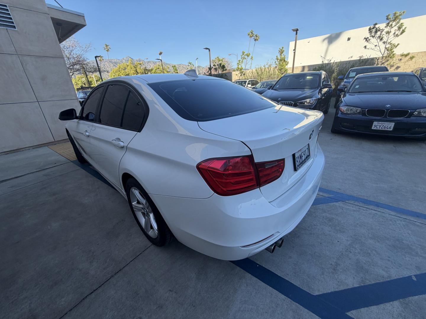 2013 White /Black BMW 3-Series 328i Sedan (WBA3C1C56DK) with an 2.0L L4 DOHC 16V engine, Automatic transmission, located at 30 S. Berkeley Avenue, Pasadena, CA, 91107, (626) 248-7567, 34.145447, -118.109398 - Looking for a sleek and stylish sedan that won't break the bank? Look no further than this 2013 BMW 3-Series 328i Sedan. With its classic design and top-of-the-line features, this car is sure to turn heads on the road. And with our buy here pay here financing options, you can drive away with the car - Photo#2