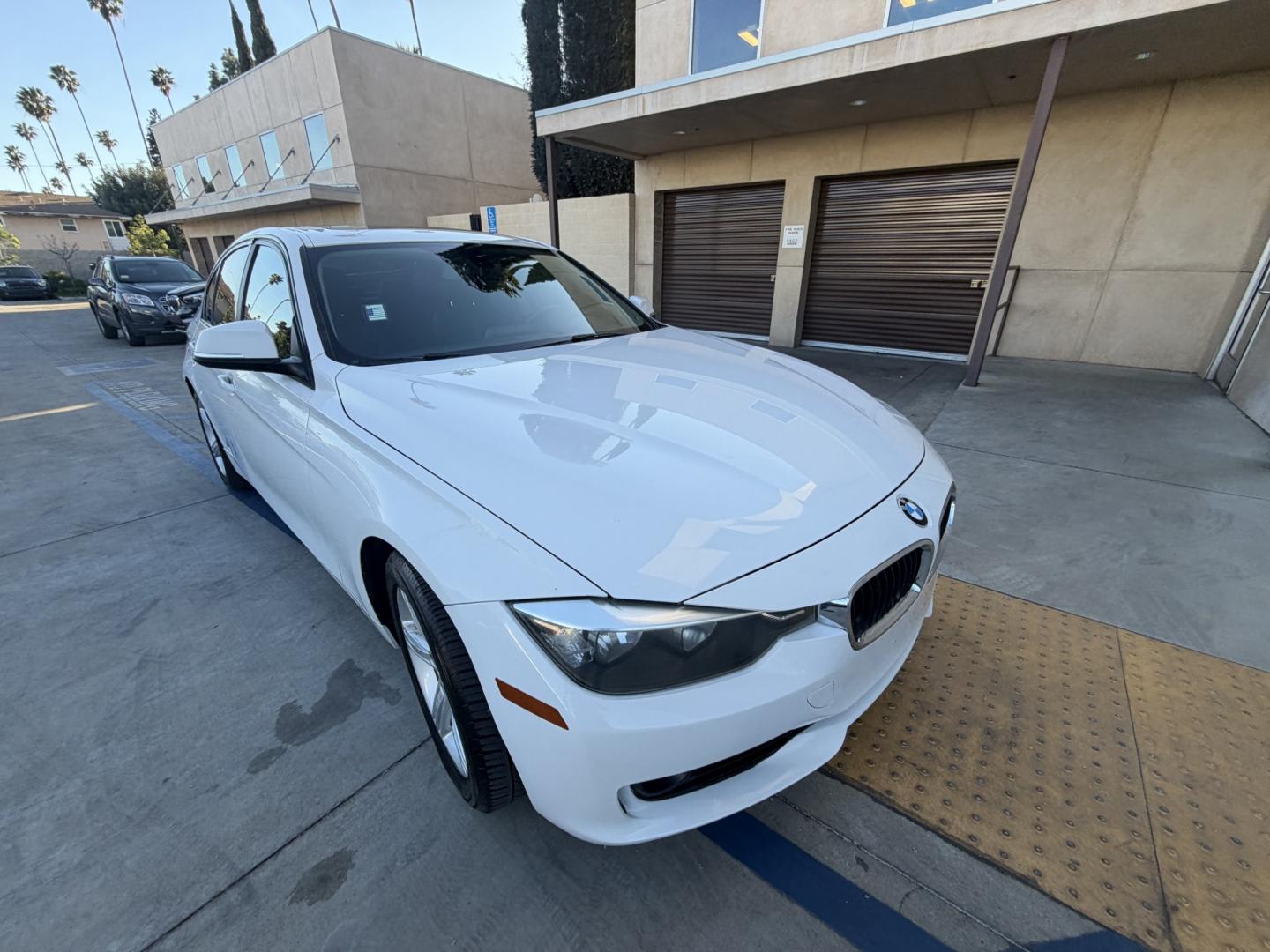 2013 White /Black BMW 3-Series 328i Sedan (WBA3C1C56DK) with an 2.0L L4 DOHC 16V engine, Automatic transmission, located at 30 S. Berkeley Avenue, Pasadena, CA, 91107, (626) 248-7567, 34.145447, -118.109398 - Looking for a sleek and stylish sedan that won't break the bank? Look no further than this 2013 BMW 3-Series 328i Sedan. With its classic design and top-of-the-line features, this car is sure to turn heads on the road. And with our buy here pay here financing options, you can drive away with the car - Photo#6