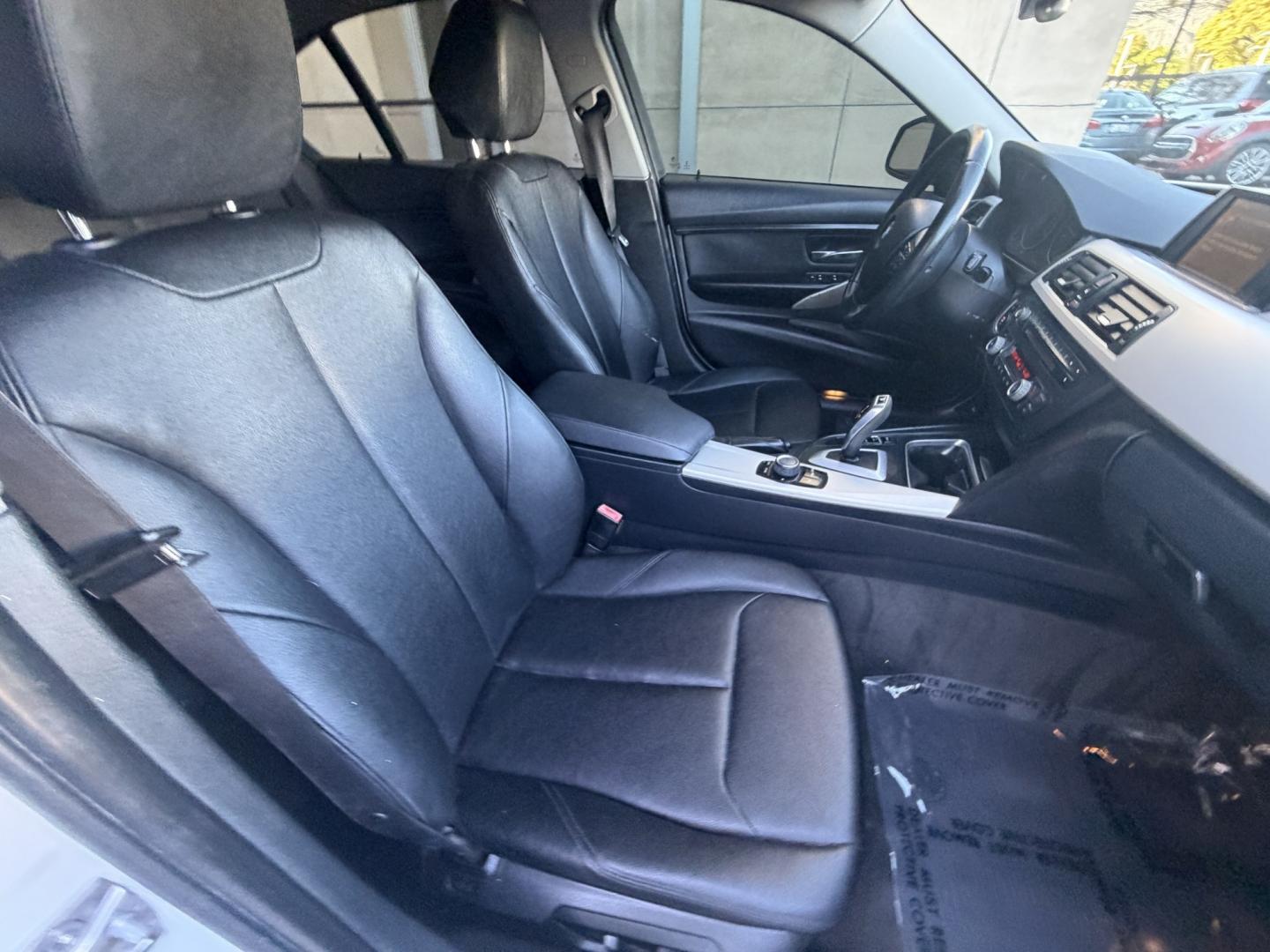 2013 White /Black BMW 3-Series 328i Sedan (WBA3C1C56DK) with an 2.0L L4 DOHC 16V engine, Automatic transmission, located at 30 S. Berkeley Avenue, Pasadena, CA, 91107, (626) 248-7567, 34.145447, -118.109398 - Looking for a sleek and stylish sedan that won't break the bank? Look no further than this 2013 BMW 3-Series 328i Sedan. With its classic design and top-of-the-line features, this car is sure to turn heads on the road. And with our buy here pay here financing options, you can drive away with the car - Photo#12