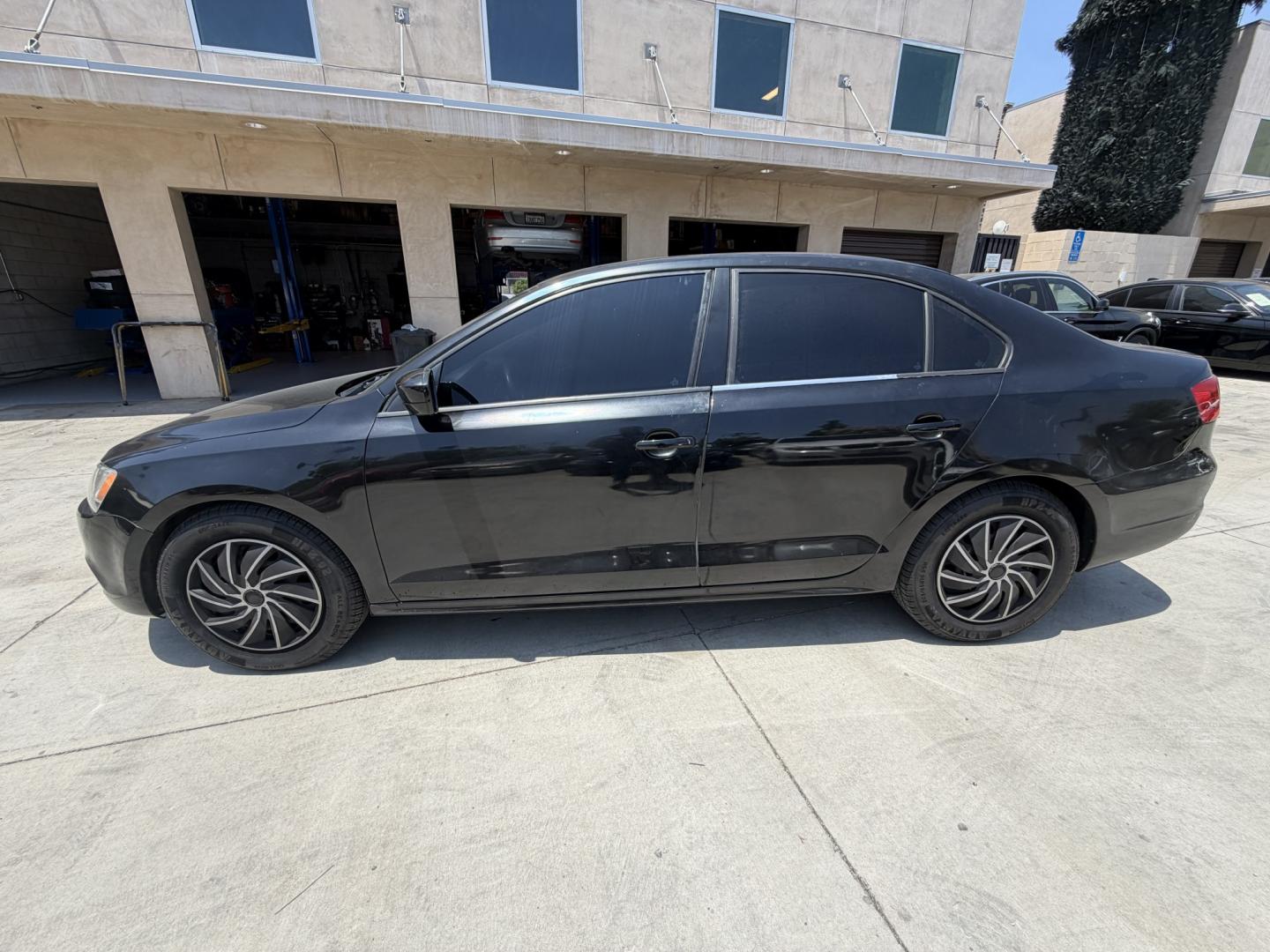 2013 Black /Black Volkswagen Jetta S (3VW2K7AJXDM) with an 2.0L L4 DOHC 20V engine, Automatic transmission, located at 30 S. Berkeley Avenue, Pasadena, CA, 91107, (626) 248-7567, 34.145447, -118.109398 - 2013 Volkswagen Jetta S – Buy Here Pay Here – Easy Financing in Pasadena, CA Looking for a reliable, stylish, and fuel-efficient sedan that won’t break the bank? This 2013 Volkswagen Jetta S is the perfect choice for drivers in Pasadena and the surrounding Los Angeles area who want dependable - Photo#1