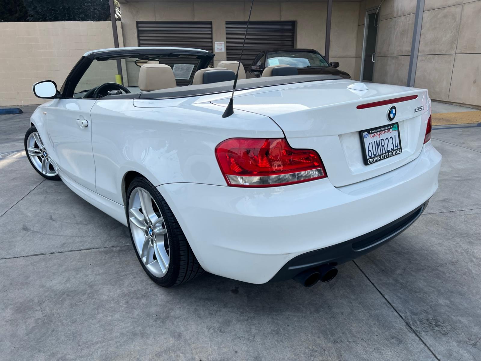 2012 White /Tan BMW 1-Series 135i Convertible (WBAUN7C5XCV) with an 3.0L L6 DOHC 24V engine, automatic transmission, located at 30 S. Berkeley Avenue, Pasadena, CA, 91107, (626) 248-7567, 34.145447, -118.109398 - Looking for a high-performance vehicle that is sure to turn heads on the road? The 2012 BMW 1-Series 135i Convertible is an excellent choice. With its M-Appearance package and luxurious leather seats, this convertible is designed to make a statement. Whether you're cruising down the highway or takin - Photo #9