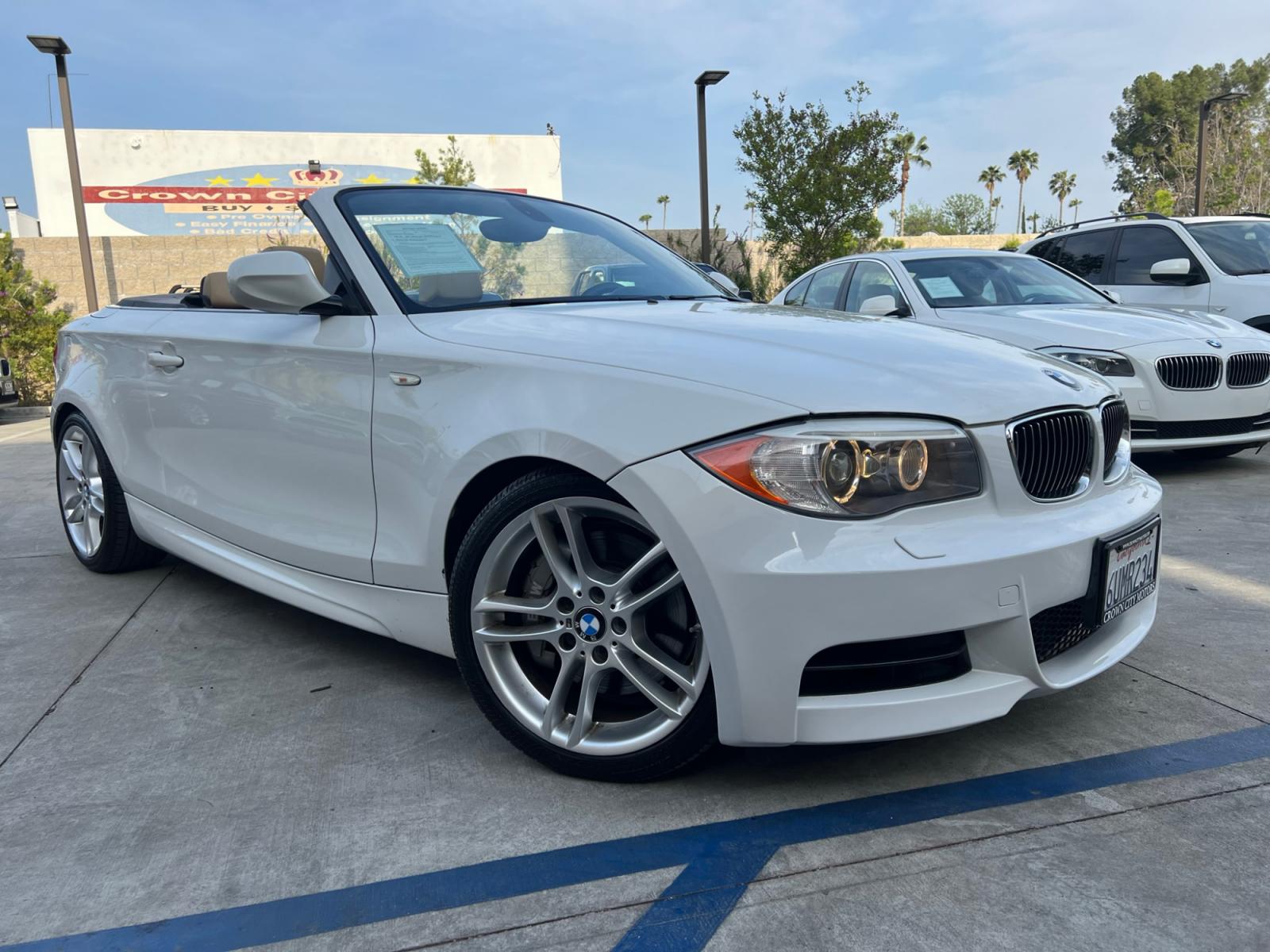 2012 White /Tan BMW 1-Series 135i Convertible (WBAUN7C5XCV) with an 3.0L L6 DOHC 24V engine, automatic transmission, located at 30 S. Berkeley Avenue, Pasadena, CA, 91107, (626) 248-7567, 34.145447, -118.109398 - Looking for a high-performance vehicle that is sure to turn heads on the road? The 2012 BMW 1-Series 135i Convertible is an excellent choice. With its M-Appearance package and luxurious leather seats, this convertible is designed to make a statement. Whether you're cruising down the highway or takin - Photo #11