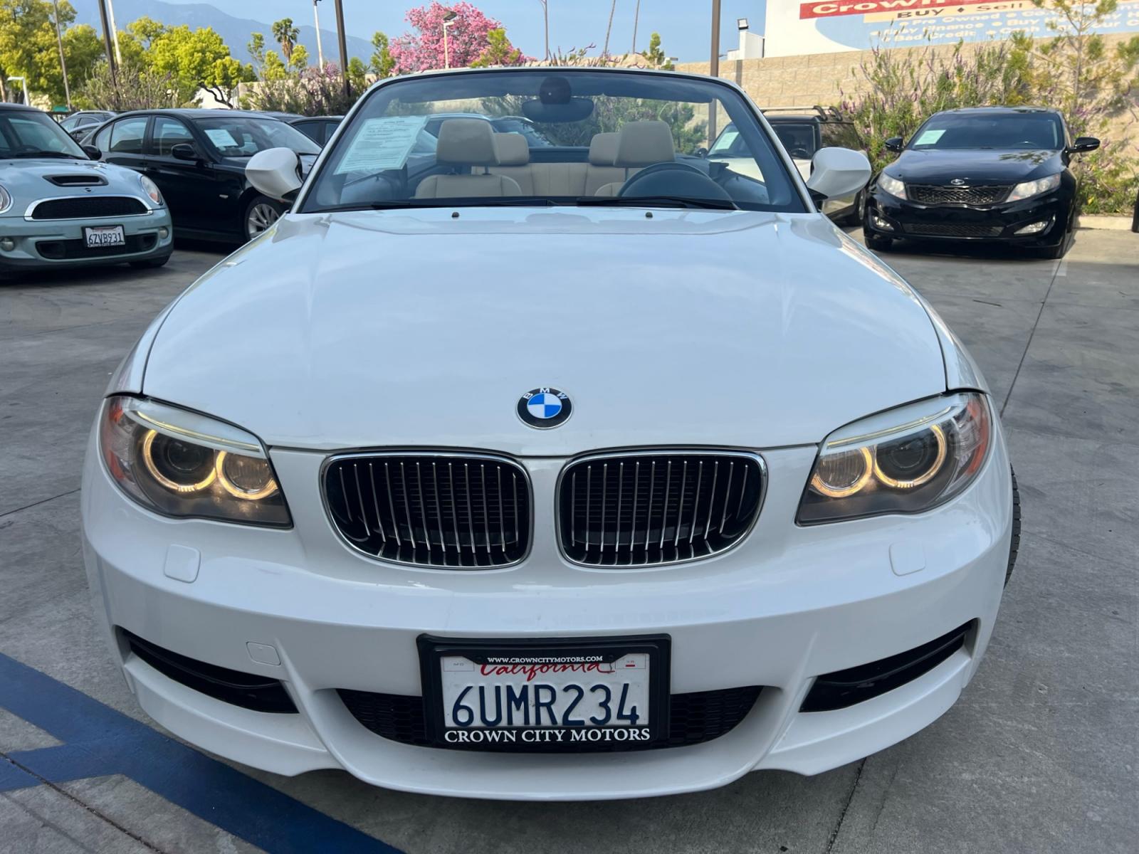2012 White /Tan BMW 1-Series 135i Convertible (WBAUN7C5XCV) with an 3.0L L6 DOHC 24V engine, automatic transmission, located at 30 S. Berkeley Avenue, Pasadena, CA, 91107, (626) 248-7567, 34.145447, -118.109398 - Looking for a high-performance vehicle that is sure to turn heads on the road? The 2012 BMW 1-Series 135i Convertible is an excellent choice. With its M-Appearance package and luxurious leather seats, this convertible is designed to make a statement. Whether you're cruising down the highway or takin - Photo #12