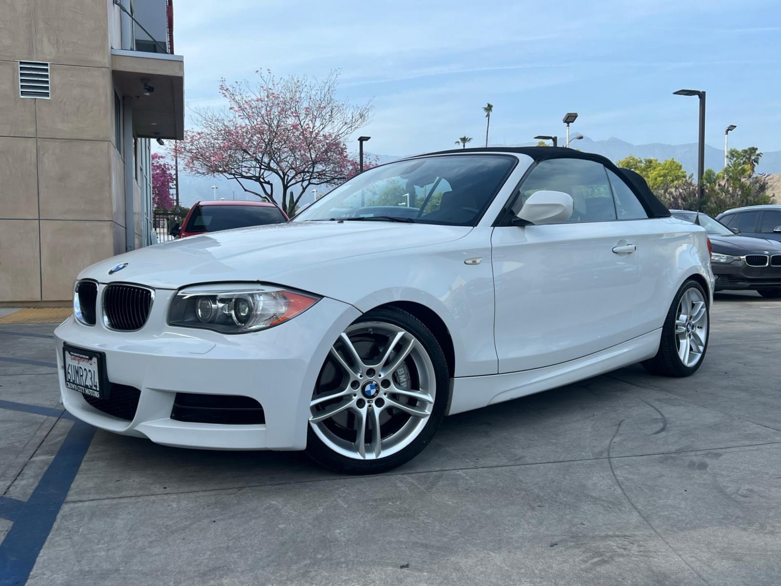 2012 White /Tan BMW 1-Series 135i Convertible (WBAUN7C5XCV) with an 3.0L L6 DOHC 24V engine, automatic transmission, located at 30 S. Berkeley Avenue, Pasadena, CA, 91107, (626) 248-7567, 34.145447, -118.109398 - Looking for a high-performance vehicle that is sure to turn heads on the road? The 2012 BMW 1-Series 135i Convertible is an excellent choice. With its M-Appearance package and luxurious leather seats, this convertible is designed to make a statement. Whether you're cruising down the highway or takin - Photo #1