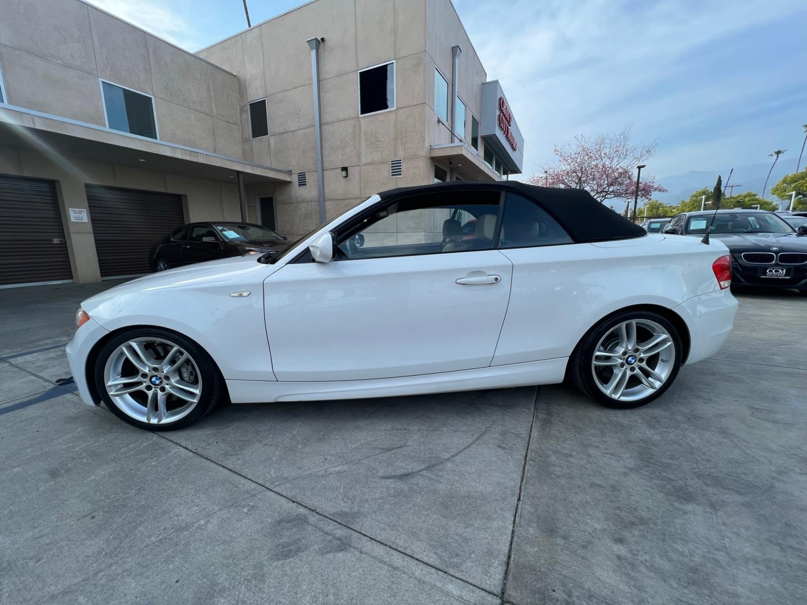 2012 White /Tan BMW 1-Series 135i Convertible (WBAUN7C5XCV) with an 3.0L L6 DOHC 24V engine, automatic transmission, located at 30 S. Berkeley Avenue, Pasadena, CA, 91107, (626) 248-7567, 34.145447, -118.109398 - Looking for a high-performance vehicle that is sure to turn heads on the road? The 2012 BMW 1-Series 135i Convertible is an excellent choice. With its M-Appearance package and luxurious leather seats, this convertible is designed to make a statement. Whether you're cruising down the highway or takin - Photo #2