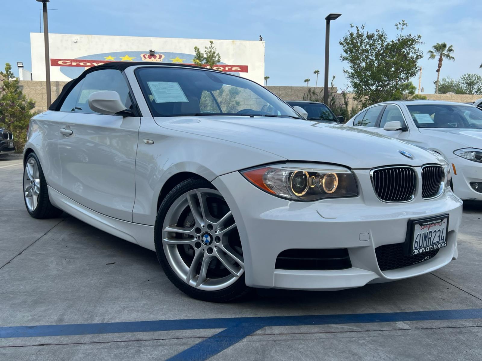 2012 White /Tan BMW 1-Series 135i Convertible (WBAUN7C5XCV) with an 3.0L L6 DOHC 24V engine, automatic transmission, located at 30 S. Berkeley Avenue, Pasadena, CA, 91107, (626) 248-7567, 34.145447, -118.109398 - Looking for a high-performance vehicle that is sure to turn heads on the road? The 2012 BMW 1-Series 135i Convertible is an excellent choice. With its M-Appearance package and luxurious leather seats, this convertible is designed to make a statement. Whether you're cruising down the highway or takin - Photo #6
