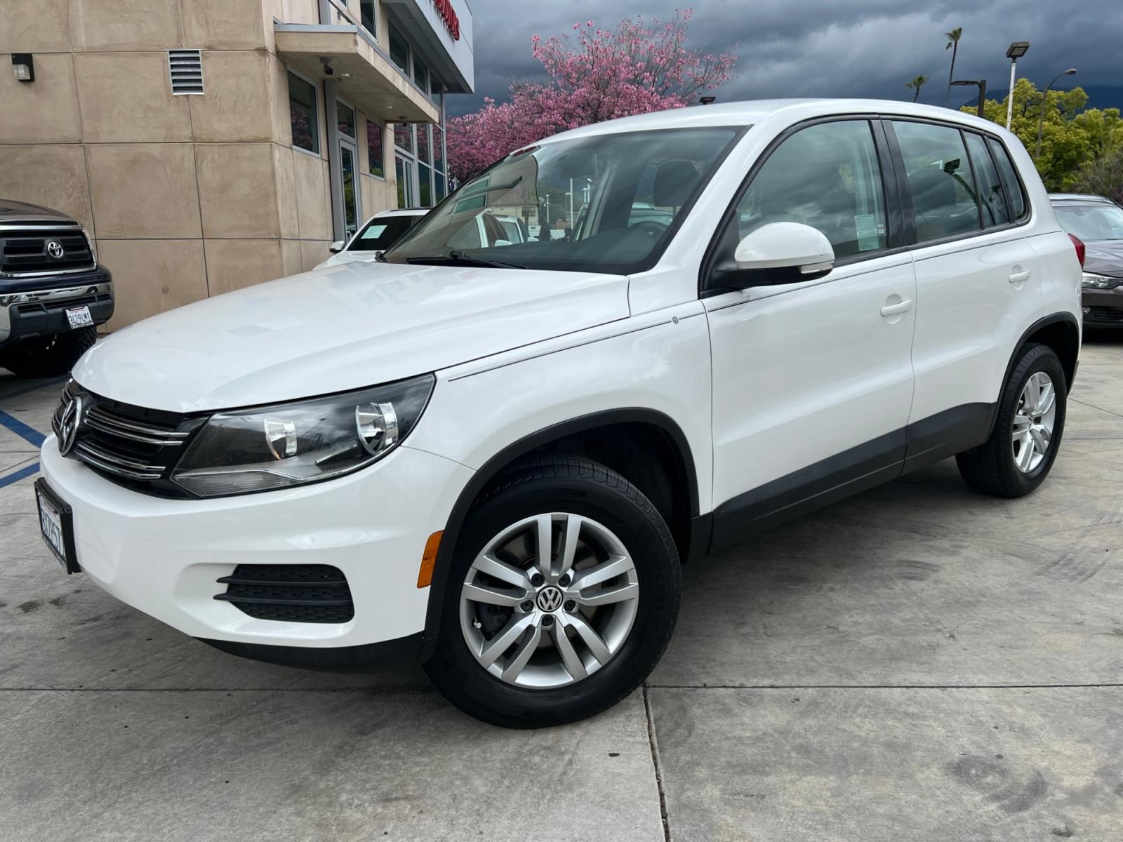 2014 White Volkswagen Tiguan S (WVGAV3AX0EW) with an 2.0L L4 DOHC 16V TURBO engine, AUTOMATIC transmission, located at 30 S. Berkeley Avenue, Pasadena, CA, 91107, (626) 248-7567, 34.145447, -118.109398 - Crown City Motors is a used “Buy Here Pay Here” car dealer in Pasadena CA. “Buy Here Pay Here” financing, means that when you purchase your vehicle from our dealership, that you make the payments to the dealership as well. We do not need the banks approval to get you approved for a used auto - Photo #1