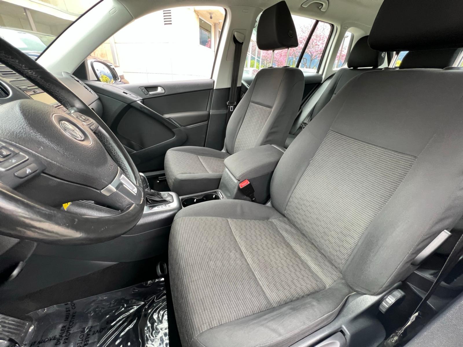 2014 White Volkswagen Tiguan S (WVGAV3AX0EW) with an 2.0L L4 DOHC 16V TURBO engine, AUTOMATIC transmission, located at 30 S. Berkeley Avenue, Pasadena, CA, 91107, (626) 248-7567, 34.145447, -118.109398 - Crown City Motors is a used “Buy Here Pay Here” car dealer in Pasadena CA. “Buy Here Pay Here” financing, means that when you purchase your vehicle from our dealership, that you make the payments to the dealership as well. We do not need the banks approval to get you approved for a used auto - Photo #12