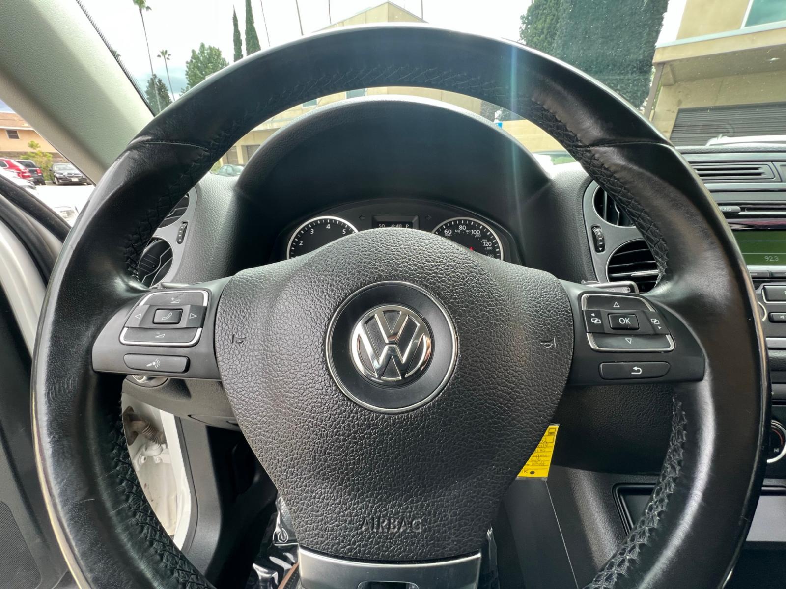 2014 White Volkswagen Tiguan S (WVGAV3AX0EW) with an 2.0L L4 DOHC 16V TURBO engine, AUTOMATIC transmission, located at 30 S. Berkeley Avenue, Pasadena, CA, 91107, (626) 248-7567, 34.145447, -118.109398 - Crown City Motors is a used “Buy Here Pay Here” car dealer in Pasadena CA. “Buy Here Pay Here” financing, means that when you purchase your vehicle from our dealership, that you make the payments to the dealership as well. We do not need the banks approval to get you approved for a used auto - Photo #20