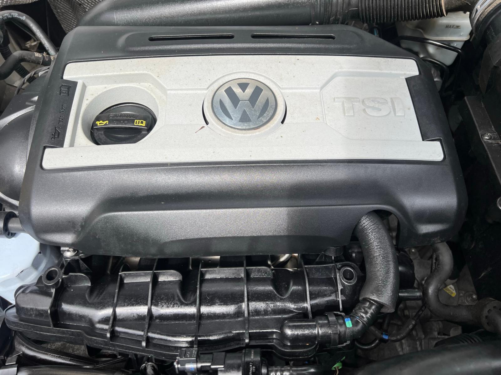 2014 White Volkswagen Tiguan S (WVGAV3AX0EW) with an 2.0L L4 DOHC 16V TURBO engine, AUTOMATIC transmission, located at 30 S. Berkeley Avenue, Pasadena, CA, 91107, (626) 248-7567, 34.145447, -118.109398 - Crown City Motors is a used “Buy Here Pay Here” car dealer in Pasadena CA. “Buy Here Pay Here” financing, means that when you purchase your vehicle from our dealership, that you make the payments to the dealership as well. We do not need the banks approval to get you approved for a used auto - Photo #22