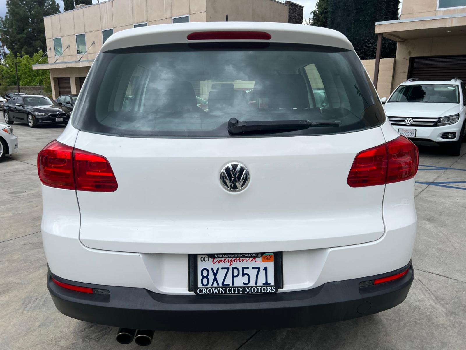 2014 White Volkswagen Tiguan S (WVGAV3AX0EW) with an 2.0L L4 DOHC 16V TURBO engine, AUTOMATIC transmission, located at 30 S. Berkeley Avenue, Pasadena, CA, 91107, (626) 248-7567, 34.145447, -118.109398 - Crown City Motors is a used “Buy Here Pay Here” car dealer in Pasadena CA. “Buy Here Pay Here” financing, means that when you purchase your vehicle from our dealership, that you make the payments to the dealership as well. We do not need the banks approval to get you approved for a used auto - Photo #4