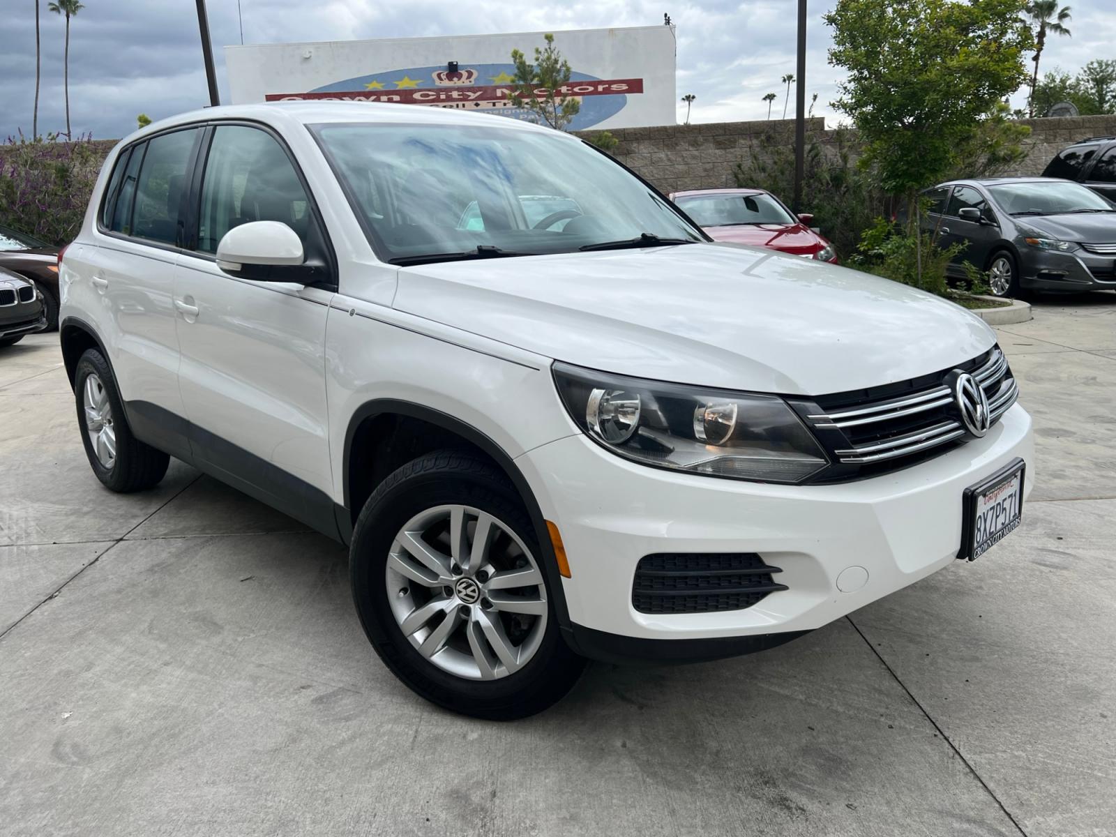 2014 White Volkswagen Tiguan S (WVGAV3AX0EW) with an 2.0L L4 DOHC 16V TURBO engine, AUTOMATIC transmission, located at 30 S. Berkeley Avenue, Pasadena, CA, 91107, (626) 248-7567, 34.145447, -118.109398 - Crown City Motors is a used “Buy Here Pay Here” car dealer in Pasadena CA. “Buy Here Pay Here” financing, means that when you purchase your vehicle from our dealership, that you make the payments to the dealership as well. We do not need the banks approval to get you approved for a used auto - Photo #5