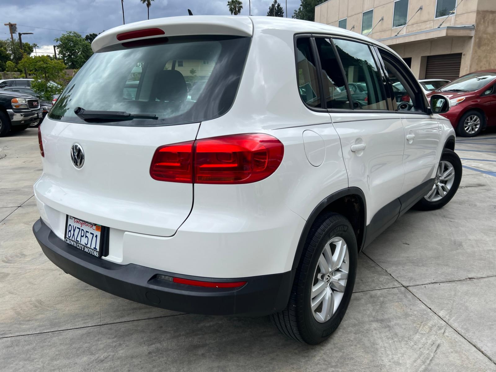 2014 White Volkswagen Tiguan S (WVGAV3AX0EW) with an 2.0L L4 DOHC 16V TURBO engine, AUTOMATIC transmission, located at 30 S. Berkeley Avenue, Pasadena, CA, 91107, (626) 248-7567, 34.145447, -118.109398 - Crown City Motors is a used “Buy Here Pay Here” car dealer in Pasadena CA. “Buy Here Pay Here” financing, means that when you purchase your vehicle from our dealership, that you make the payments to the dealership as well. We do not need the banks approval to get you approved for a used auto - Photo #7