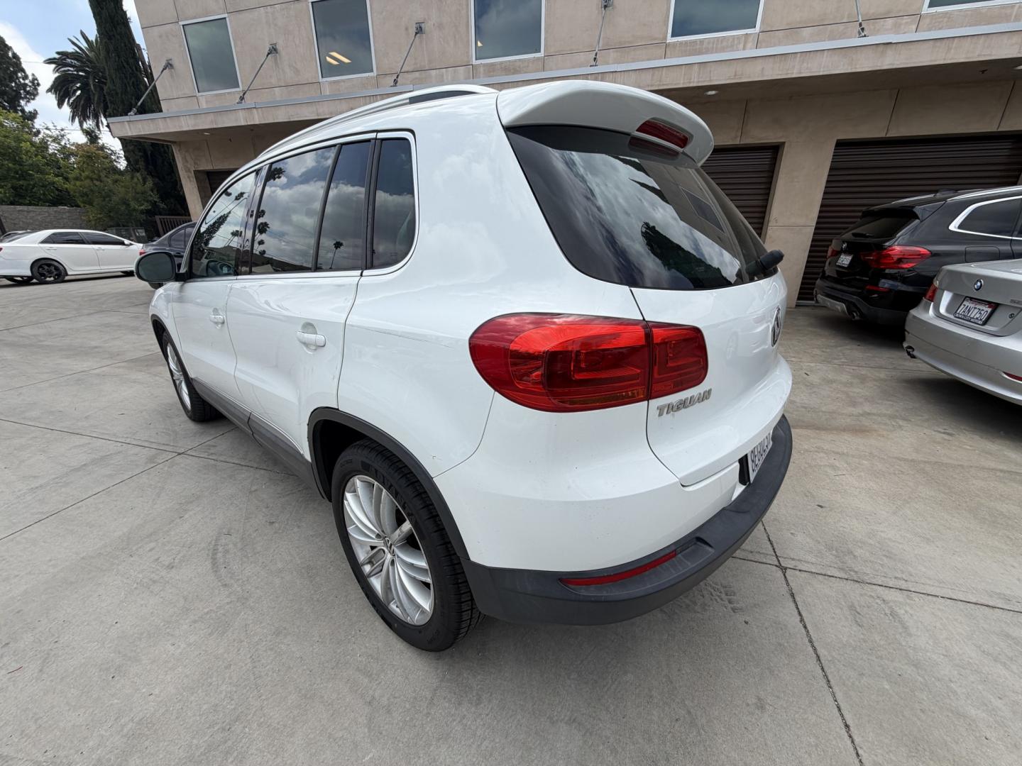 2015 White Volkswagen Tiguan S (WVGAV7AX6FW) with an 2.0L L4 DOHC 16V TURBO engine, 6-Speed Automatic transmission, located at 30 S. Berkeley Avenue, Pasadena, CA, 91107, (626) 248-7567, 34.145447, -118.109398 - Leather! Moon-Roof! Navigation! This 2015 Volkswagen Tiguan SEL looks and drives well. This vehicle comes with a dealer 30 day / 1,000 Mile Warranty ( call us for details) and with Options up to 5 years / 100,000 Mile Warranty. Bad credit? We can help! We are the bank. Buy with confidence! All of ou - Photo#2