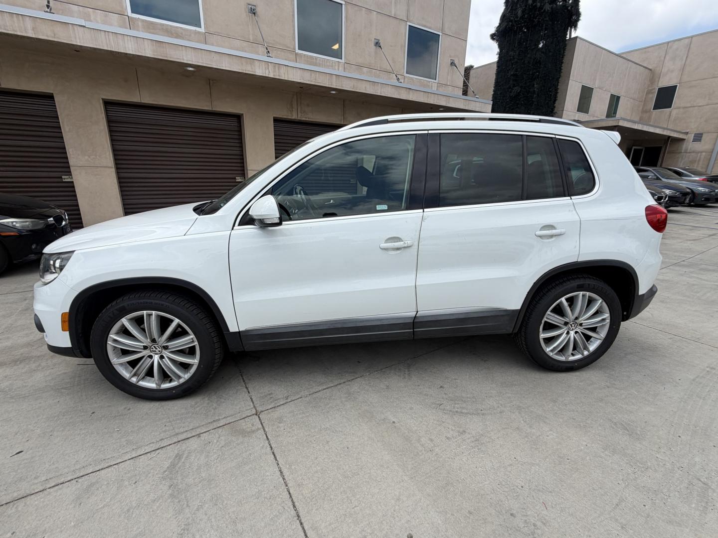 2015 White Volkswagen Tiguan S (WVGAV7AX6FW) with an 2.0L L4 DOHC 16V TURBO engine, 6-Speed Automatic transmission, located at 30 S. Berkeley Avenue, Pasadena, CA, 91107, (626) 248-7567, 34.145447, -118.109398 - Leather! Moon-Roof! Navigation! This 2015 Volkswagen Tiguan SEL looks and drives well. This vehicle comes with a dealer 30 day / 1,000 Mile Warranty ( call us for details) and with Options up to 5 years / 100,000 Mile Warranty. Bad credit? We can help! We are the bank. Buy with confidence! All of ou - Photo#1