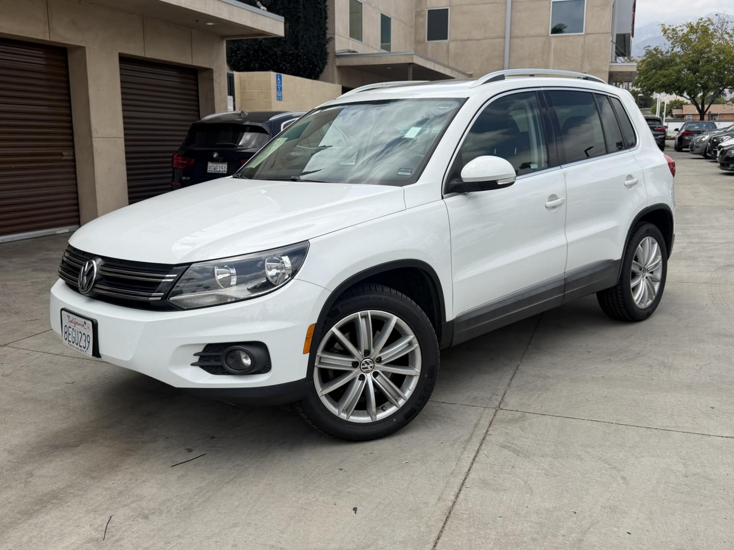 2015 White Volkswagen Tiguan S (WVGAV7AX6FW) with an 2.0L L4 DOHC 16V TURBO engine, 6-Speed Automatic transmission, located at 30 S. Berkeley Avenue, Pasadena, CA, 91107, (626) 248-7567, 34.145447, -118.109398 - Leather! Moon-Roof! Navigation! This 2015 Volkswagen Tiguan SEL looks and drives well. This vehicle comes with a dealer 30 day / 1,000 Mile Warranty ( call us for details) and with Options up to 5 years / 100,000 Mile Warranty. Bad credit? We can help! We are the bank. Buy with confidence! All of ou - Photo#0
