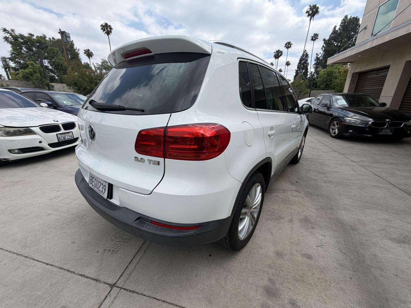 2015 White Volkswagen Tiguan S (WVGAV7AX6FW) with an 2.0L L4 DOHC 16V TURBO engine, 6-Speed Automatic transmission, located at 30 S. Berkeley Avenue, Pasadena, CA, 91107, (626) 248-7567, 34.145447, -118.109398 - Leather! Moon-Roof! Navigation! This 2015 Volkswagen Tiguan SEL looks and drives well. This vehicle comes with a dealer 30 day / 1,000 Mile Warranty ( call us for details) and with Options up to 5 years / 100,000 Mile Warranty. Bad credit? We can help! We are the bank. Buy with confidence! All of ou - Photo#4