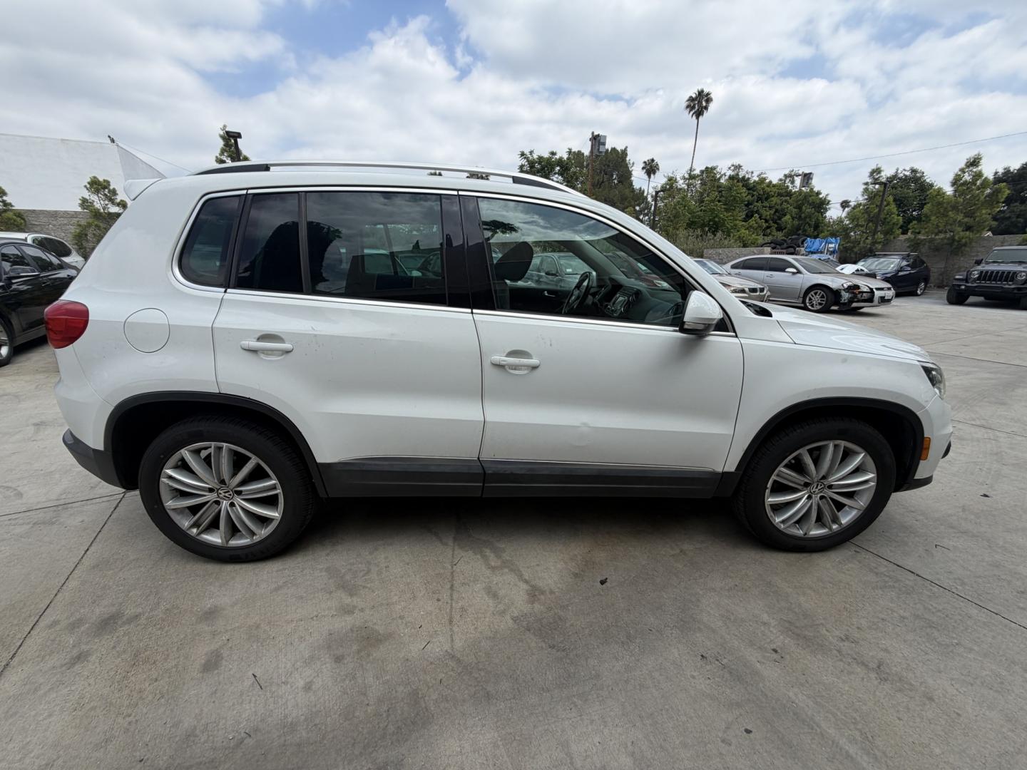 2015 White Volkswagen Tiguan S (WVGAV7AX6FW) with an 2.0L L4 DOHC 16V TURBO engine, 6-Speed Automatic transmission, located at 30 S. Berkeley Avenue, Pasadena, CA, 91107, (626) 248-7567, 34.145447, -118.109398 - Leather! Moon-Roof! Navigation! This 2015 Volkswagen Tiguan SEL looks and drives well. This vehicle comes with a dealer 30 day / 1,000 Mile Warranty ( call us for details) and with Options up to 5 years / 100,000 Mile Warranty. Bad credit? We can help! We are the bank. Buy with confidence! All of ou - Photo#5