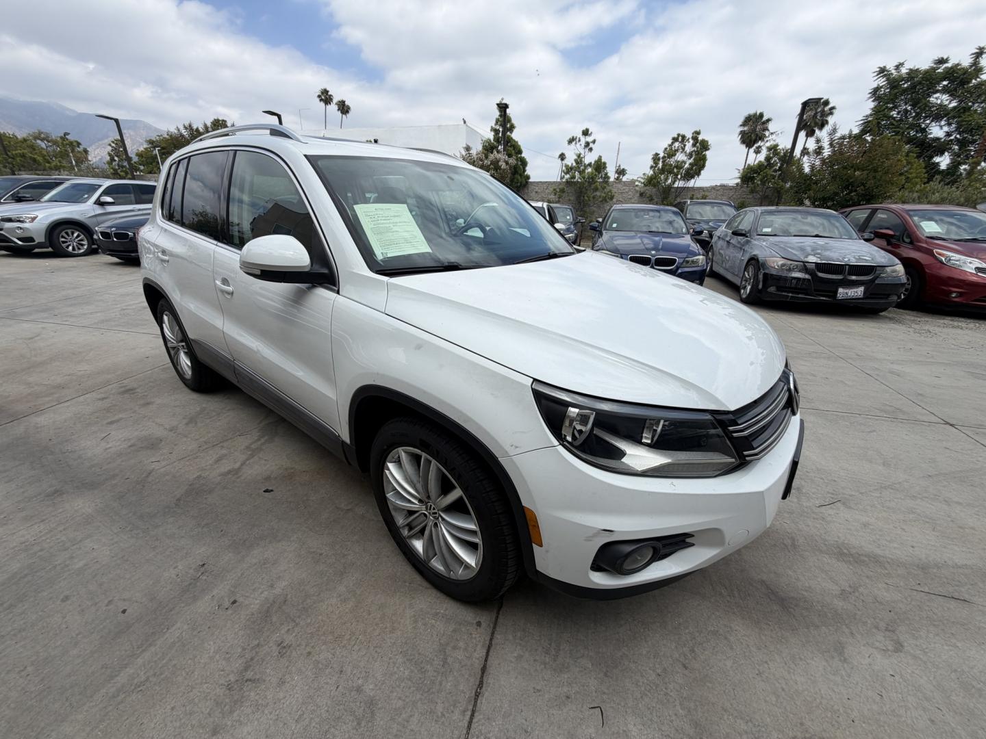 2015 White Volkswagen Tiguan S (WVGAV7AX6FW) with an 2.0L L4 DOHC 16V TURBO engine, 6-Speed Automatic transmission, located at 30 S. Berkeley Avenue, Pasadena, CA, 91107, (626) 248-7567, 34.145447, -118.109398 - Leather! Moon-Roof! Navigation! This 2015 Volkswagen Tiguan SEL looks and drives well. This vehicle comes with a dealer 30 day / 1,000 Mile Warranty ( call us for details) and with Options up to 5 years / 100,000 Mile Warranty. Bad credit? We can help! We are the bank. Buy with confidence! All of ou - Photo#6