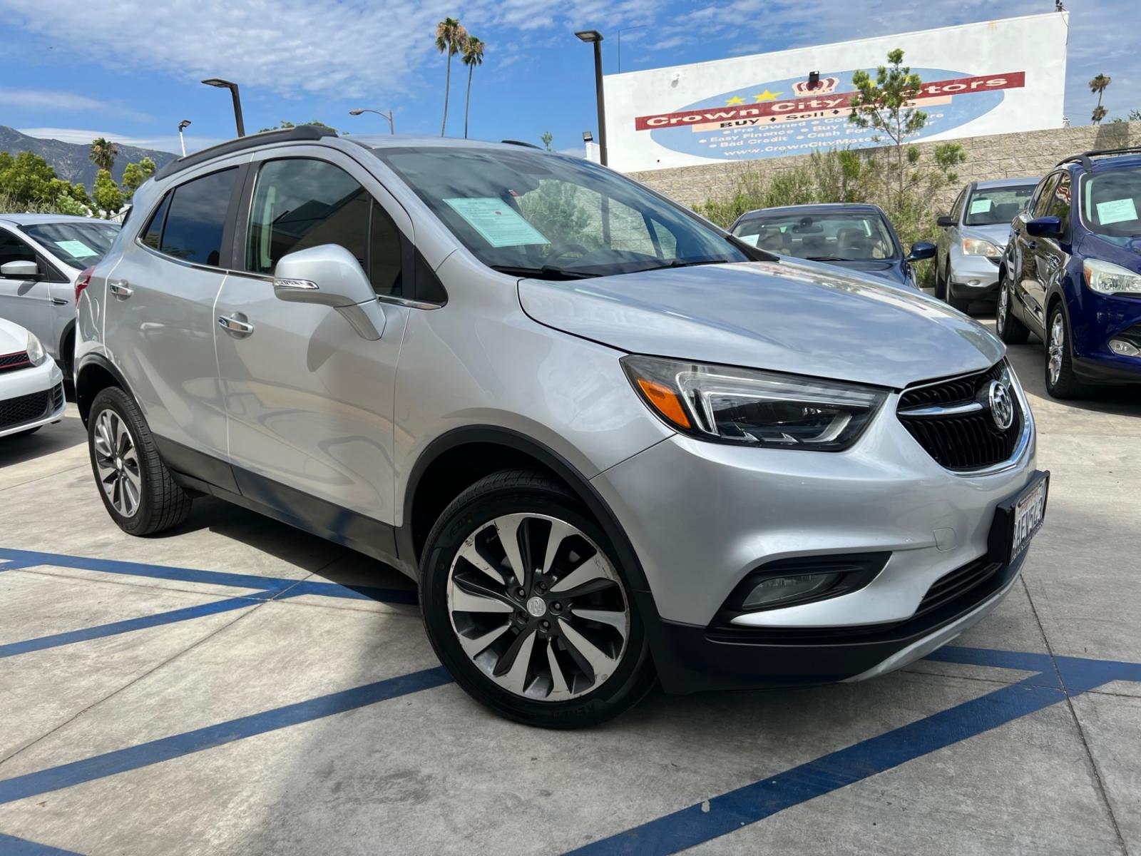 2018 Silver Buick Encore Essence AWD (KL4CJGSB7JB) with an 1.4L L4 DOHC 16V TURBO engine, 6A transmission, located at 30 S. Berkeley Avenue, Pasadena, CA, 91107, (626) 248-7567, 34.145447, -118.109398 - Crown City Motors is a used “Buy Here Pay Here” car dealer in Pasadena CA. “Buy Here Pay Here” financing, means that when you purchase your vehicle from our dealership, that you make the payments to the dealership as well. We do not need the banks approval to get you approved for a used auto - Photo #3