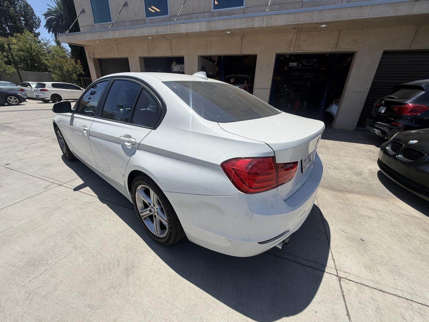 2013 White BMW 3-Series 328i Sedan (WBA3C1C52DF) with an 2.0L L4 DOHC 16V engine, AUTOMATIC transmission, located at 30 S. Berkeley Avenue, Pasadena, CA, 91107, (626) 248-7567, 34.145447, -118.109398 - Crown City Motors is a used “Buy Here Pay Here” car dealer in Pasadena CA. “Buy Here Pay Here” financing, means that when you purchase your vehicle from our dealership, that you make the payments to the dealership as well. We do not need the banks approval to get you approved for a used auto- Photo#2