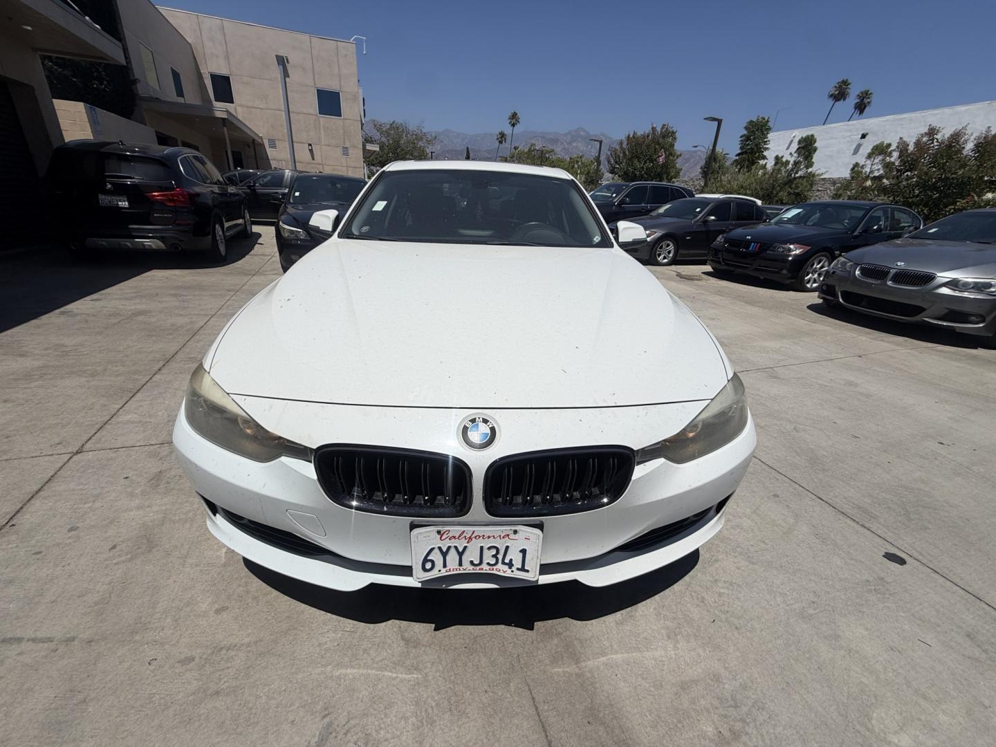 2013 White BMW 3-Series 328i Sedan (WBA3C1C52DF) with an 2.0L L4 DOHC 16V engine, AUTOMATIC transmission, located at 30 S. Berkeley Avenue, Pasadena, CA, 91107, (626) 248-7567, 34.145447, -118.109398 - Crown City Motors is a used “Buy Here Pay Here” car dealer in Pasadena CA. “Buy Here Pay Here” financing, means that when you purchase your vehicle from our dealership, that you make the payments to the dealership as well. We do not need the banks approval to get you approved for a used auto- Photo#3