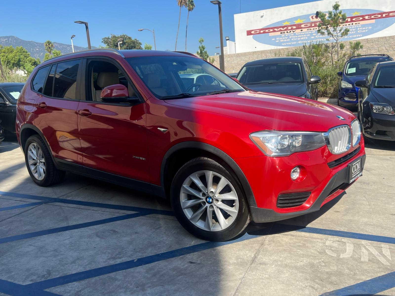 2016 RED /Tan BMW X3 xDrive28i (5UXWX9C50G0) with an 2.0L L4 DOHC 16V engine, 8-Speed Automatic transmission, located at 30 S. Berkeley Avenue, Pasadena, CA, 91107, (626) 248-7567, 34.145447, -118.109398 - Crown City Motors is a used “Buy Here Pay Here” car dealer in Pasadena CA. “Buy Here Pay Here” financing, means that when you purchase your vehicle from our dealership, that you make the payments to the dealership as well. We do not need the banks approval to get you approved for a used auto - Photo #4