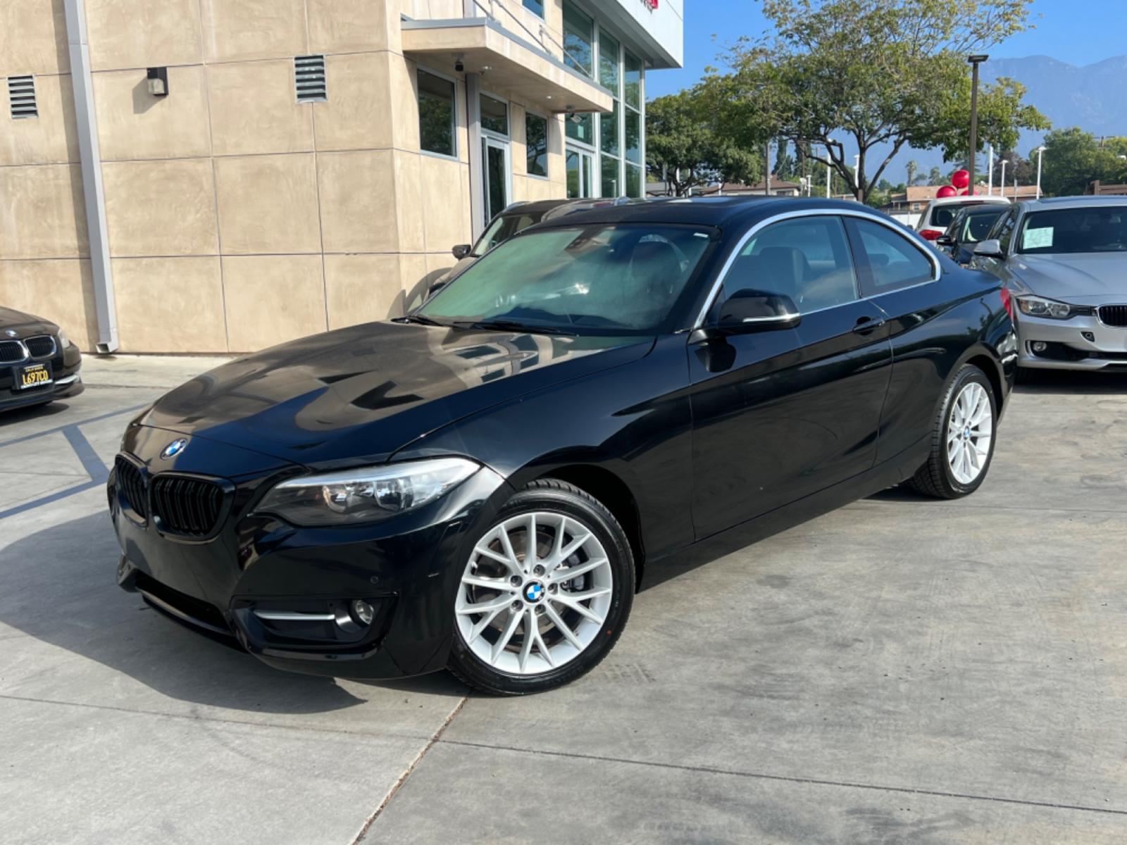 2016 Black BMW 2-Series 228i SULEV Coupe (WBA1F9C51GV) with an 2.0L L4 DOHC 16V engine, 8A transmission, located at 30 S. Berkeley Avenue, Pasadena, CA, 91107, (626) 248-7567, 34.145447, -118.109398 - Crown City Motors is a used “Buy Here Pay Here” car dealer in Pasadena CA. “Buy Here Pay Here” financing, means that when you purchase your vehicle from our dealership, that you make the payments to the dealership as well. We do not need the banks approval to get you approved for a used auto - Photo #1
