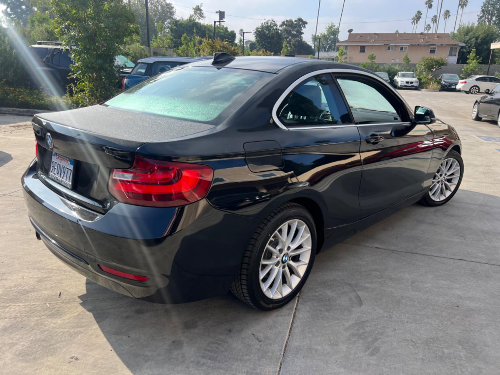 2016 Black BMW 2-Series 228i SULEV Coupe (WBA1F9C51GV) with an 2.0L L4 DOHC 16V engine, 8A transmission, located at 30 S. Berkeley Avenue, Pasadena, CA, 91107, (626) 248-7567, 34.145447, -118.109398 - Crown City Motors is a used “Buy Here Pay Here” car dealer in Pasadena CA. “Buy Here Pay Here” financing, means that when you purchase your vehicle from our dealership, that you make the payments to the dealership as well. We do not need the banks approval to get you approved for a used auto - Photo #5