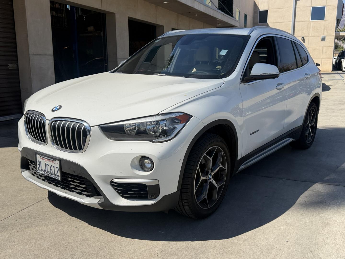 2017 WHITE /Tan BMW X1 (WBXHT3C31H5) with an 4 CYLINDER engine, Automatic transmission, located at 30 S. Berkeley Avenue, Pasadena, CA, 91107, (626) 248-7567, 34.145447, -118.109398 - Unleash Elegance and Performance: 2017 BMW X1 with Panoramic Roof and Sport Display - Your Premier Choice in Pasadena, CA Step into the realm of luxury with the 2017 BMW X1, an epitome of sophistication and performance. This exceptional SUV, featuring a panoramic roof, sport display, premium leat- Photo#0