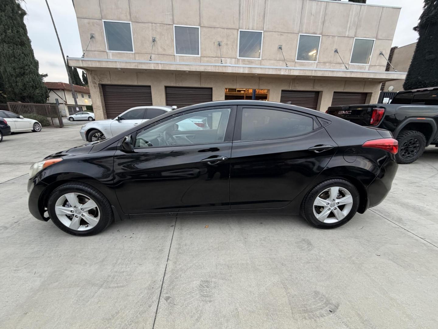 2013 Black /Black Hyundai Elantra (KMHDH4AE8DU) with an 4 Cylinder engine, Automatic transmission, located at 30 S. Berkeley Avenue, Pasadena, CA, 91107, (626) 248-7567, 34.145447, -118.109398 - Crown City Motors is a used “Buy Here Pay Here” car dealer in Pasadena CA. “Buy Here Pay Here” financing, means that when you purchase your vehicle from our dealership, that you make the payments to the dealership as well. We do not need the banks approval to get you approved for a used auto - Photo#1