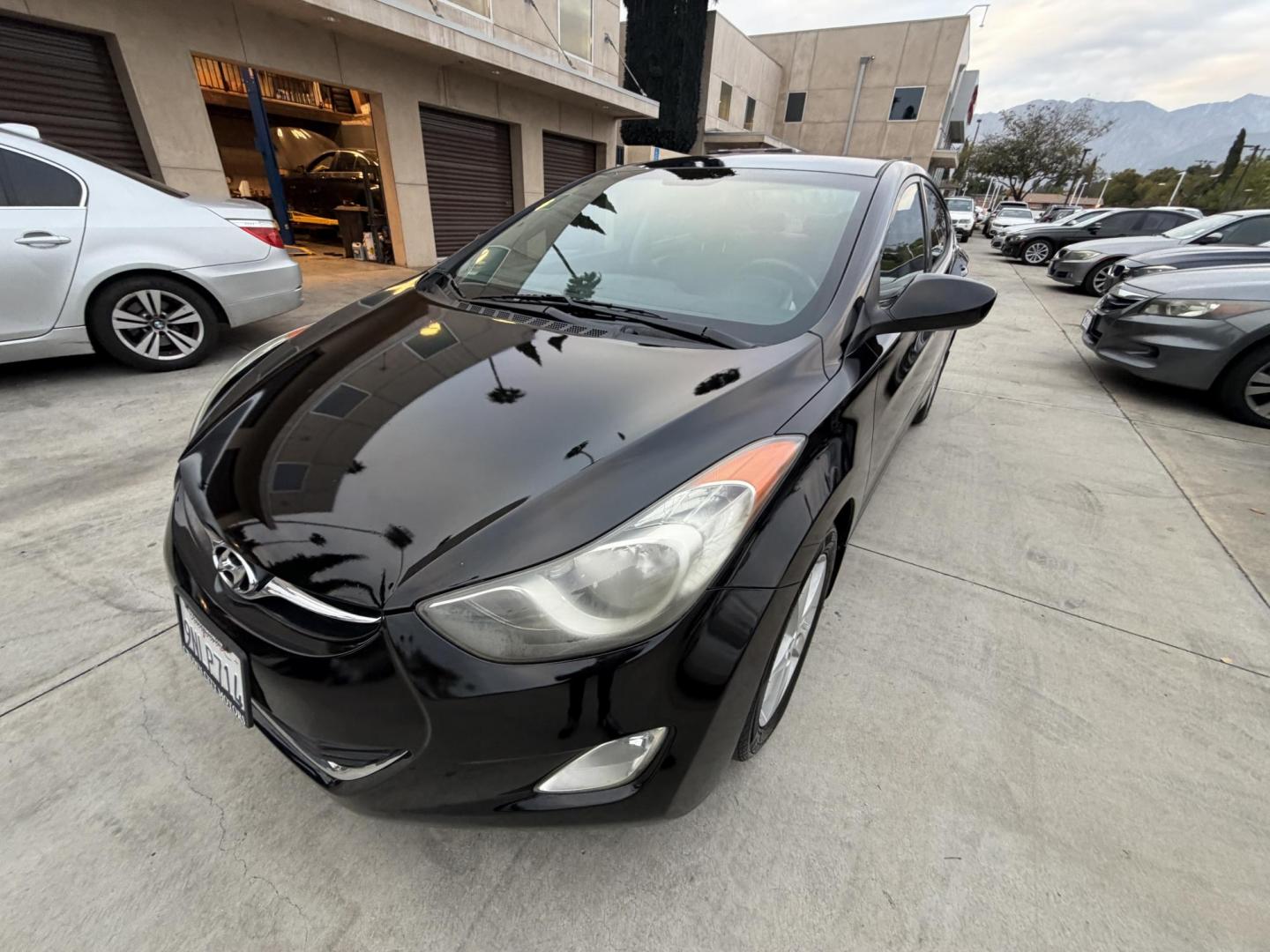 2013 Black /Black Hyundai Elantra (KMHDH4AE8DU) with an 4 Cylinder engine, Automatic transmission, located at 30 S. Berkeley Avenue, Pasadena, CA, 91107, (626) 248-7567, 34.145447, -118.109398 - Crown City Motors is a used “Buy Here Pay Here” car dealer in Pasadena CA. “Buy Here Pay Here” financing, means that when you purchase your vehicle from our dealership, that you make the payments to the dealership as well. We do not need the banks approval to get you approved for a used auto - Photo#8