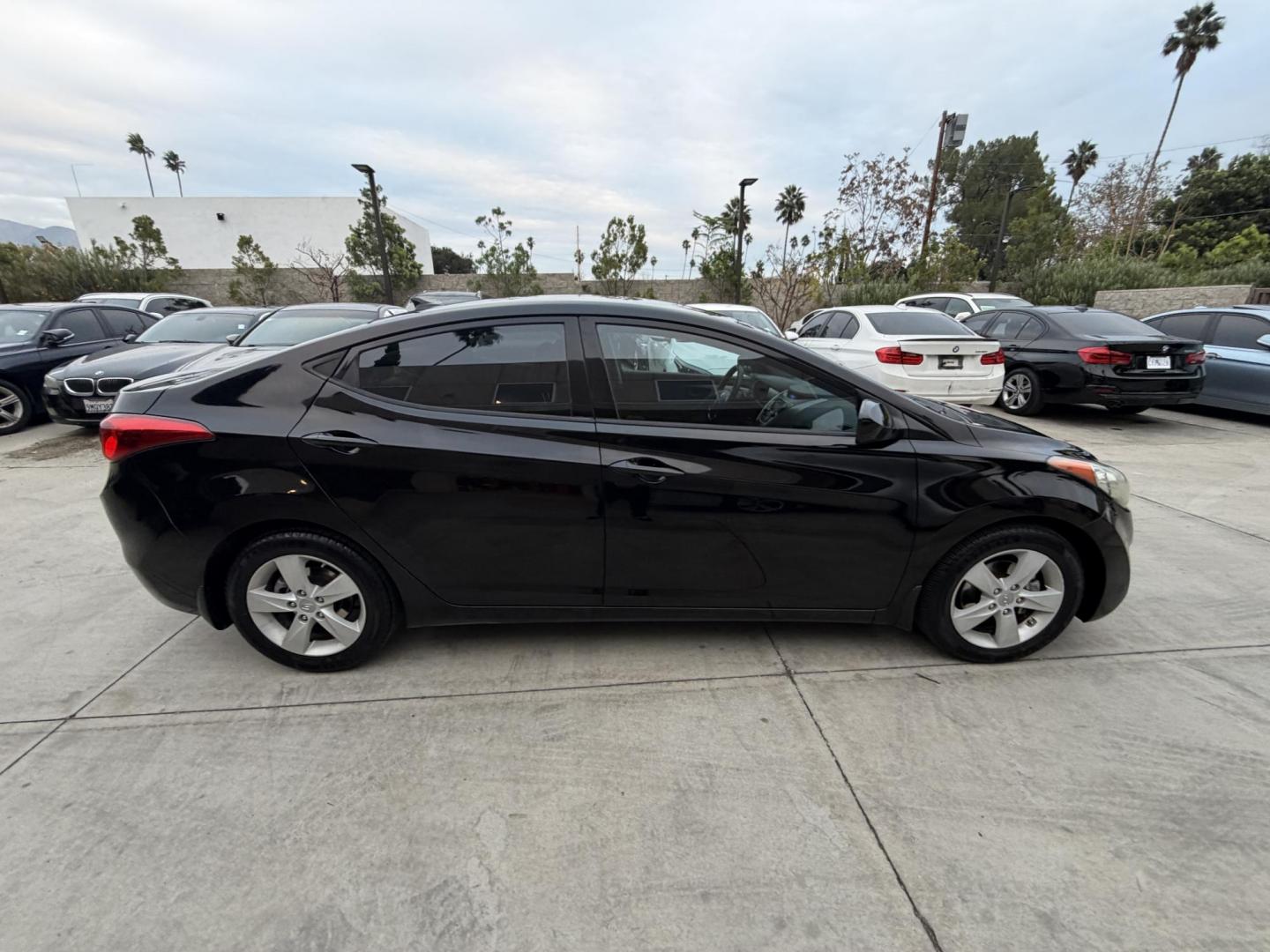 2013 Black /Black Hyundai Elantra (KMHDH4AE8DU) with an 4 Cylinder engine, Automatic transmission, located at 30 S. Berkeley Avenue, Pasadena, CA, 91107, (626) 248-7567, 34.145447, -118.109398 - Crown City Motors is a used “Buy Here Pay Here” car dealer in Pasadena CA. “Buy Here Pay Here” financing, means that when you purchase your vehicle from our dealership, that you make the payments to the dealership as well. We do not need the banks approval to get you approved for a used auto - Photo#7