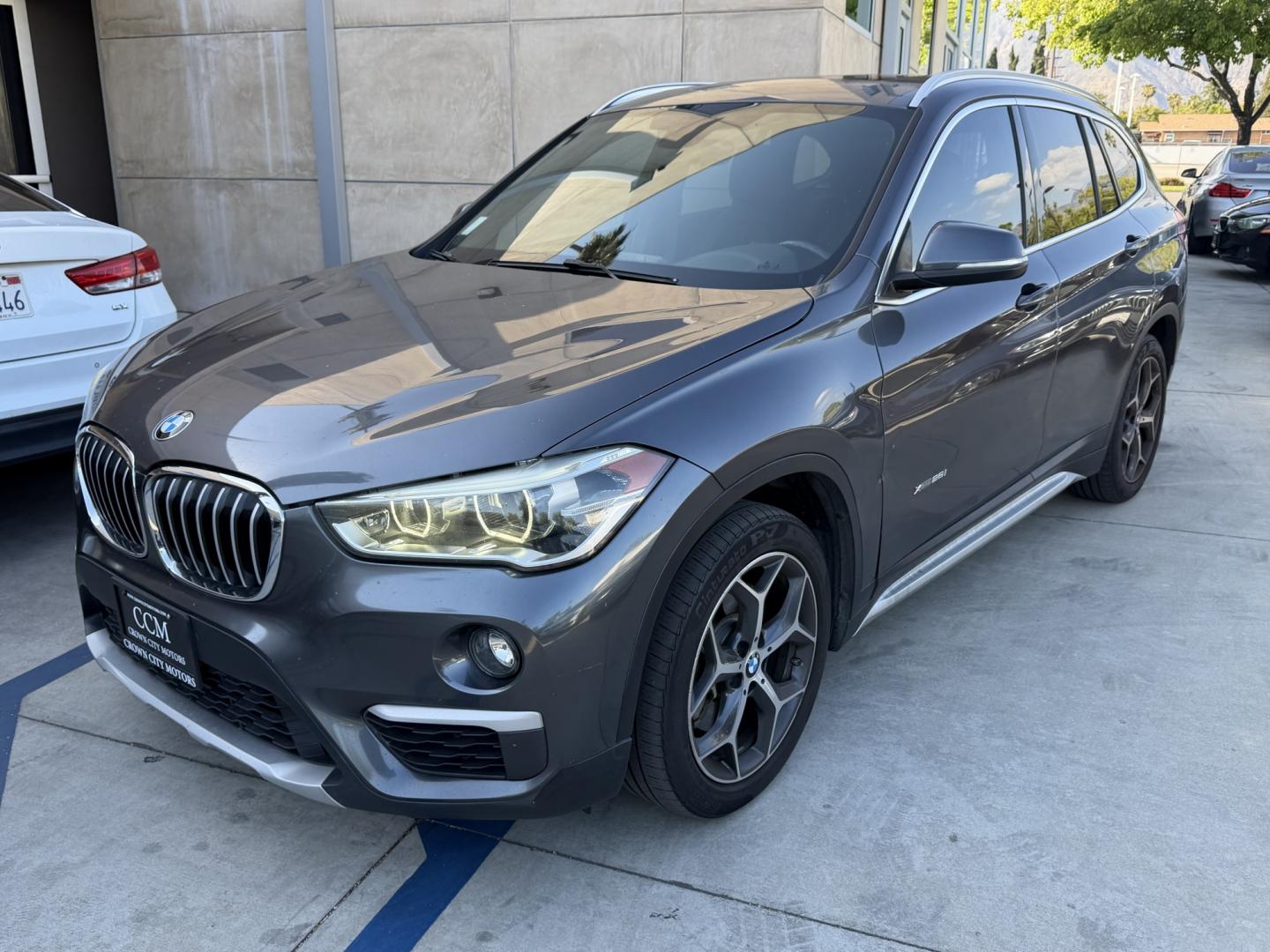 2016 Gray /Black BMW X1 leather (WBXHT3Z34G4) with an 4 CYLINDER engine, Automatic transmission, located at 30 S. Berkeley Avenue, Pasadena, CA, 91107, (626) 248-7567, 34.145447, -118.109398 - Looking for a reliable, stylish, and fuel-efficient luxury vehicle with easy financing in Pasadena, CA? This 2016 BMW X1 (VIN: WBXHT3Z34G4A48750) is the perfect combination of performance, comfort, and practicality—available now at Crown City Motors with Buy Here Pay Here financing designed for al - Photo#0