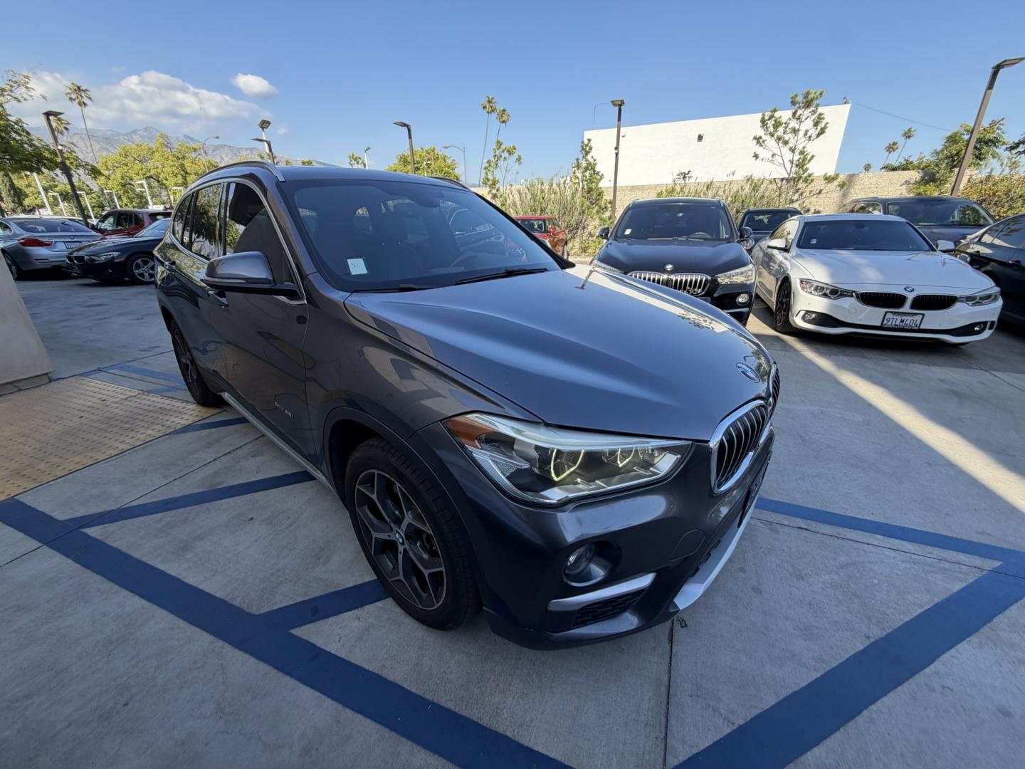2016 Gray /Black BMW X1 leather (WBXHT3Z34G4) with an 4 CYLINDER engine, Automatic transmission, located at 30 S. Berkeley Avenue, Pasadena, CA, 91107, (626) 248-7567, 34.145447, -118.109398 - Looking for a reliable, stylish, and fuel-efficient luxury vehicle with easy financing in Pasadena, CA? This 2016 BMW X1 (VIN: WBXHT3Z34G4A48750) is the perfect combination of performance, comfort, and practicality—available now at Crown City Motors with Buy Here Pay Here financing designed for al - Photo#5