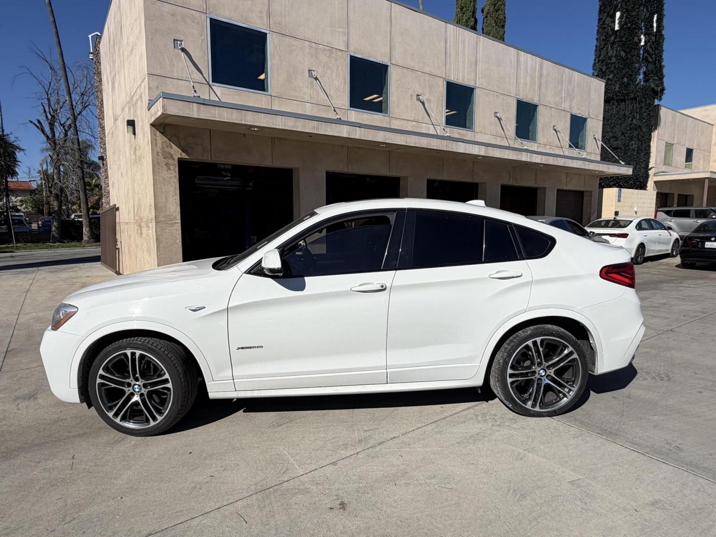 2015 Alpine White /Black BMW X4 Leather (5UXXW3C59F0) with an 2.0 engine, Automatic transmission, located at 30 S. Berkeley Avenue, Pasadena, CA, 91107, (626) 248-7567, 34.145447, -118.109398 - Discover the 2015 BMW X4 xDrive28i: Luxury Meets Affordability Are you in the market for a luxury vehicle that doesn't break the bank? Look no further than the 2015 BMW X4 xDrive28i. This impressive model offers the perfect blend of performance, style, and affordability. At our dealership, we under - Photo#2