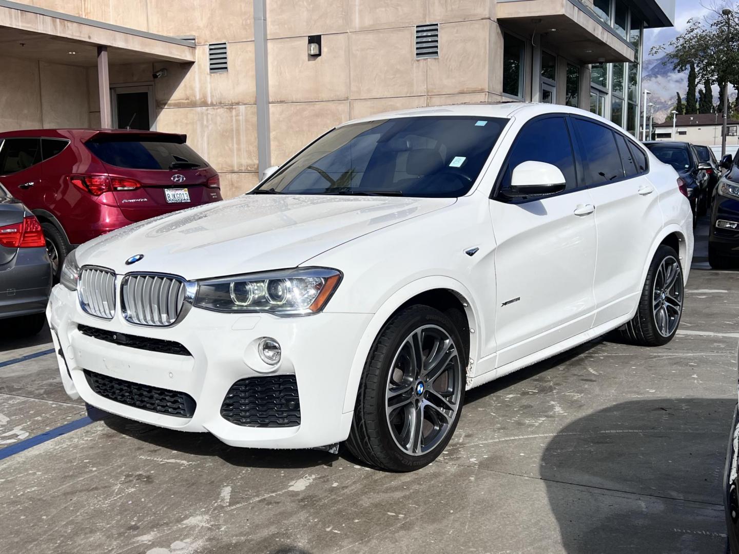 2015 Alpine White /Black BMW X4 Leather (5UXXW3C59F0) with an 2.0 engine, Automatic transmission, located at 30 S. Berkeley Avenue, Pasadena, CA, 91107, (626) 248-7567, 34.145447, -118.109398 - Discover the 2015 BMW X4 xDrive28i: Luxury Meets Affordability Are you in the market for a luxury vehicle that doesn't break the bank? Look no further than the 2015 BMW X4 xDrive28i. This impressive model offers the perfect blend of performance, style, and affordability. At our dealership, we under - Photo#4