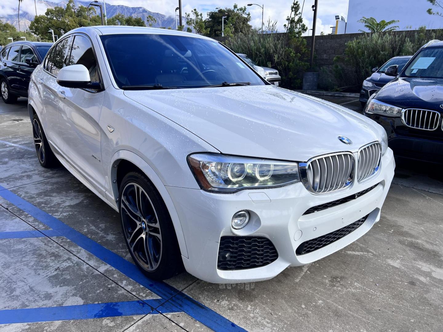 2015 Alpine White /Black BMW X4 Leather (5UXXW3C59F0) with an 2.0 engine, Automatic transmission, located at 30 S. Berkeley Avenue, Pasadena, CA, 91107, (626) 248-7567, 34.145447, -118.109398 - Discover the 2015 BMW X4 xDrive28i: Luxury Meets Affordability Are you in the market for a luxury vehicle that doesn't break the bank? Look no further than the 2015 BMW X4 xDrive28i. This impressive model offers the perfect blend of performance, style, and affordability. At our dealership, we under - Photo#11