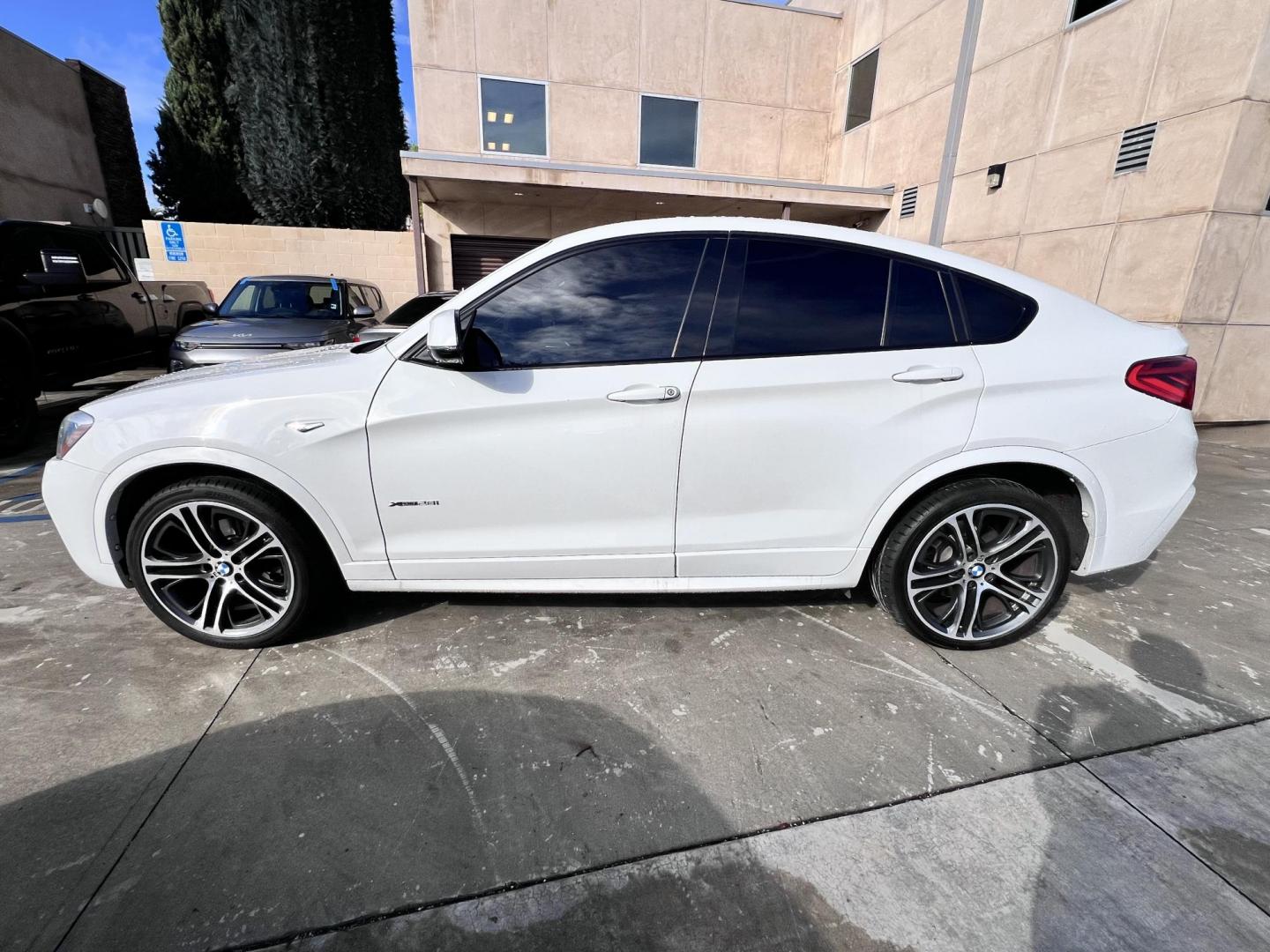2015 Alpine White /Black BMW X4 Leather (5UXXW3C59F0) with an 2.0 engine, Automatic transmission, located at 30 S. Berkeley Avenue, Pasadena, CA, 91107, (626) 248-7567, 34.145447, -118.109398 - Discover the 2015 BMW X4 xDrive28i: Luxury Meets Affordability Are you in the market for a luxury vehicle that doesn't break the bank? Look no further than the 2015 BMW X4 xDrive28i. This impressive model offers the perfect blend of performance, style, and affordability. At our dealership, we under - Photo#9