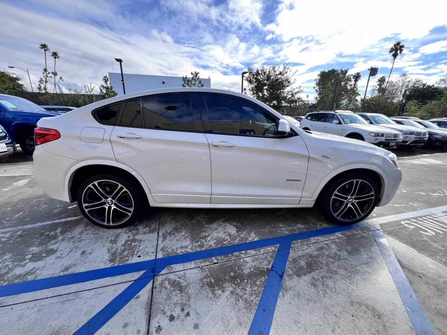 2015 Alpine White /Black BMW X4 Leather (5UXXW3C59F0) with an 2.0 engine, Automatic transmission, located at 30 S. Berkeley Avenue, Pasadena, CA, 91107, (626) 248-7567, 34.145447, -118.109398 - Discover the 2015 BMW X4 xDrive28i: Luxury Meets Affordability Are you in the market for a luxury vehicle that doesn't break the bank? Look no further than the 2015 BMW X4 xDrive28i. This impressive model offers the perfect blend of performance, style, and affordability. At our dealership, we under - Photo#12