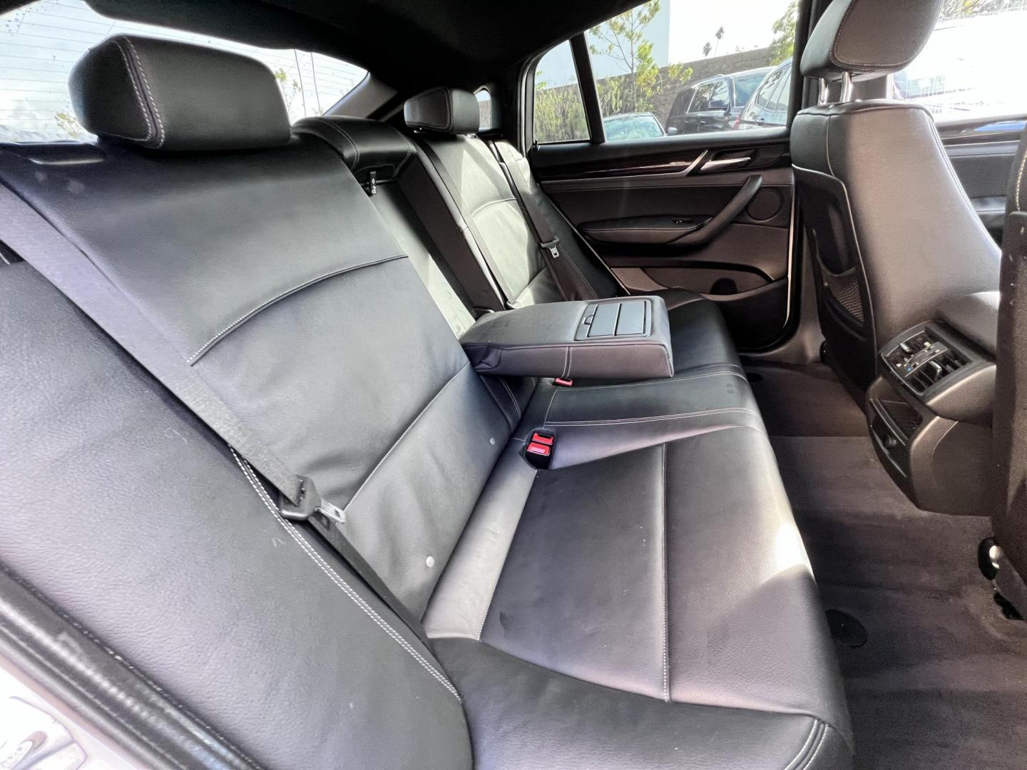 2015 Alpine White /Black BMW X4 Leather (5UXXW3C59F0) with an 2.0 engine, Automatic transmission, located at 30 S. Berkeley Avenue, Pasadena, CA, 91107, (626) 248-7567, 34.145447, -118.109398 - Discover the 2015 BMW X4 xDrive28i: Luxury Meets Affordability Are you in the market for a luxury vehicle that doesn't break the bank? Look no further than the 2015 BMW X4 xDrive28i. This impressive model offers the perfect blend of performance, style, and affordability. At our dealership, we under - Photo#23