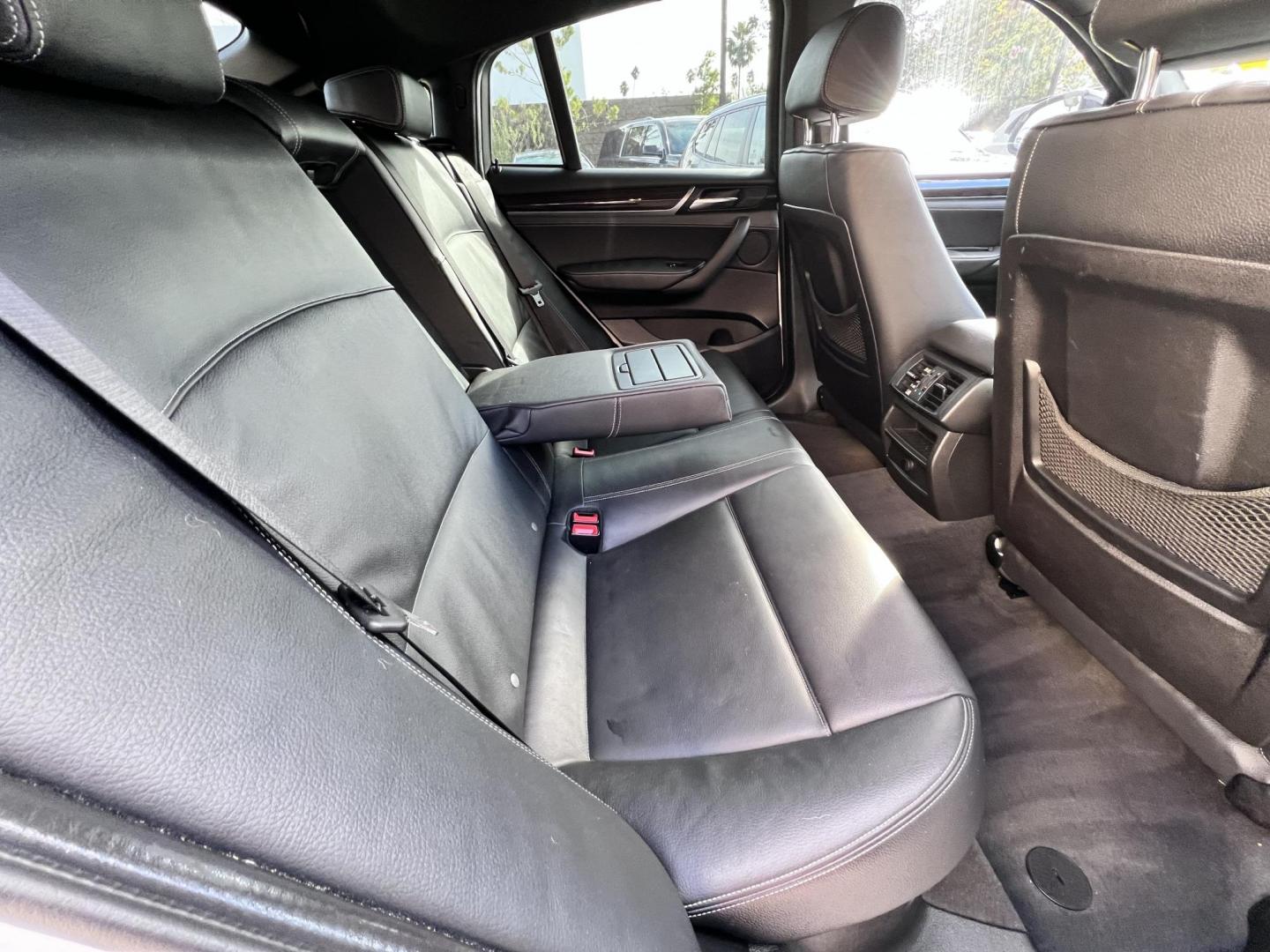 2015 Alpine White /Black BMW X4 Leather (5UXXW3C59F0) with an 2.0 engine, Automatic transmission, located at 30 S. Berkeley Avenue, Pasadena, CA, 91107, (626) 248-7567, 34.145447, -118.109398 - Discover the 2015 BMW X4 xDrive28i: Luxury Meets Affordability Are you in the market for a luxury vehicle that doesn't break the bank? Look no further than the 2015 BMW X4 xDrive28i. This impressive model offers the perfect blend of performance, style, and affordability. At our dealership, we under - Photo#24