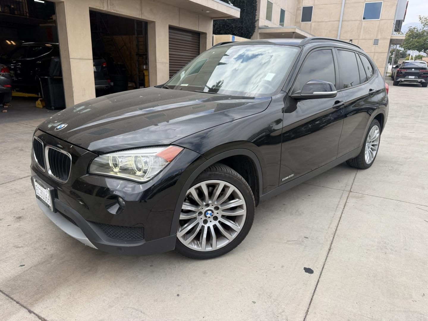 2013 Deep Sea Blue Metallic /Black BMW X1 xDrive28i (WBAVL1C56DV) with an 2.0L L4 DOHC 16V engine, 8-Speed Automatic transmission, located at 30 S. Berkeley Avenue, Pasadena, CA, 91107, (626) 248-7567, 34.145447, -118.109398 - # 2013 BMW X1 xDrive28i for Sale in Pasadena, CA – Buy Here Pay Here Financing Available If you're looking for a luxury crossover SUV that offers BMW performance, all-wheel-drive capability, premium comfort, and flexible financing options, this 2013 BMW X1 xDrive28i is an excellent choice. Avai- Photo#0
