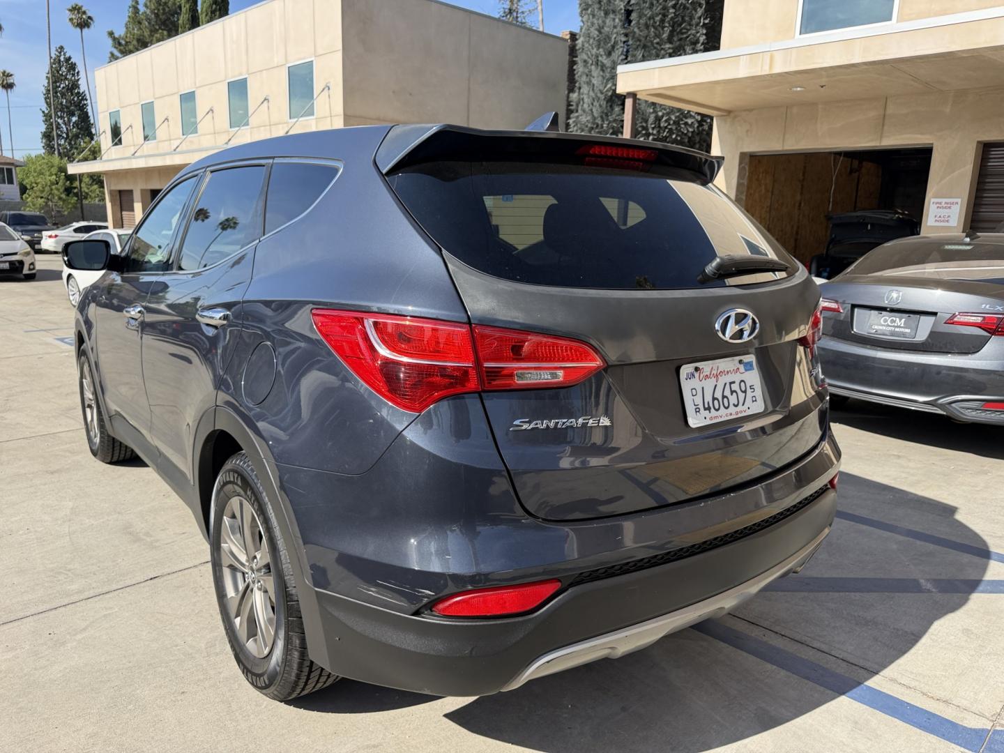 2014 Night Sky Pearl. /Gray Hyundai Santa Fe Sport 2.4 FWD (5XYZT3LB4EG) with an 2.4L L4 DOHC 16V engine, 6-Speed Automatic transmission, located at 30 S. Berkeley Avenue, Pasadena, CA, 91107, (626) 248-7567, 34.145447, -118.109398 - DEALER IDENTIFIER: Crown City Motors Sales | Buy Here Pay Here Pasadena TARGET REGIONS: Pasadena, San Gabriel Valley, Riverside, San Bernardino FINANCING SPECIALTY: Subprime Auto Lending, In-House Financing, Bad Credit Car Loans CA VEHICLE: 2014 Hyundai Santa Fe Sport 2.4L (VIN: 5XYZT3LB4EG131415- Photo#1