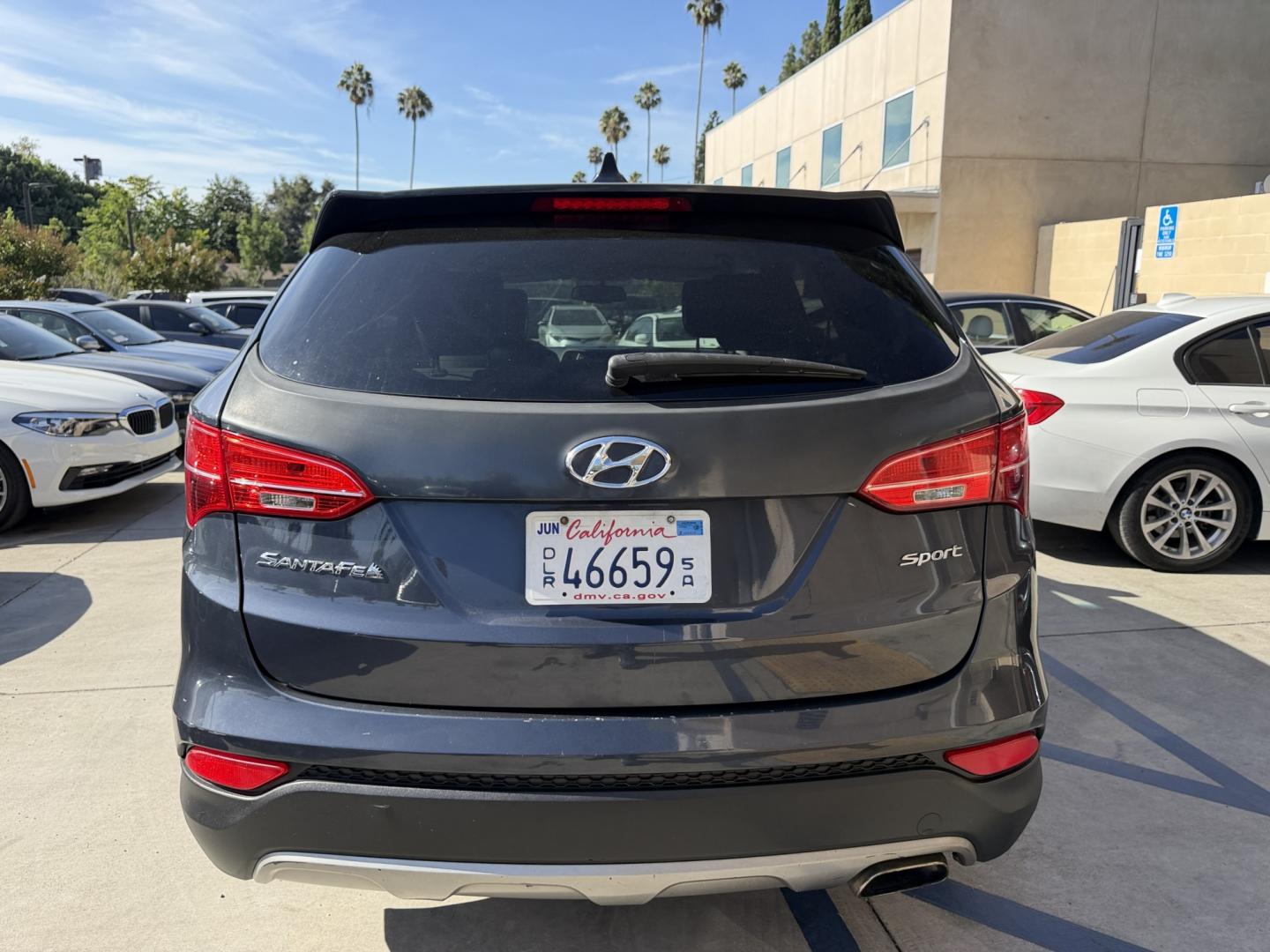2014 Night Sky Pearl. /Gray Hyundai Santa Fe Sport 2.4 FWD (5XYZT3LB4EG) with an 2.4L L4 DOHC 16V engine, 6-Speed Automatic transmission, located at 30 S. Berkeley Avenue, Pasadena, CA, 91107, (626) 248-7567, 34.145447, -118.109398 - DEALER IDENTIFIER: Crown City Motors Sales | Buy Here Pay Here Pasadena TARGET REGIONS: Pasadena, San Gabriel Valley, Riverside, San Bernardino FINANCING SPECIALTY: Subprime Auto Lending, In-House Financing, Bad Credit Car Loans CA VEHICLE: 2014 Hyundai Santa Fe Sport 2.4L (VIN: 5XYZT3LB4EG131415- Photo#6